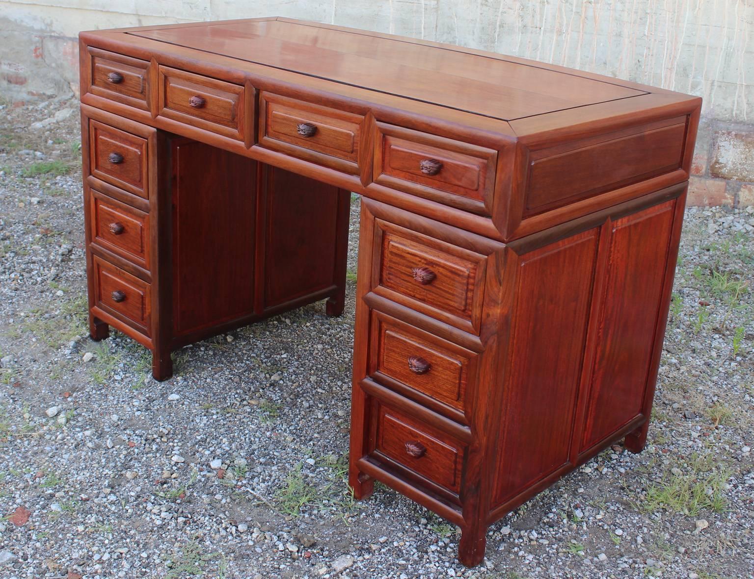 Vintage Asian solid rosewood double pedestal desk. In excellent vintage condition and it breaks down into three pieces for easier moving and shipping.

If you are looking for a desk, look no more. This is an outstanding piece of furniture. A