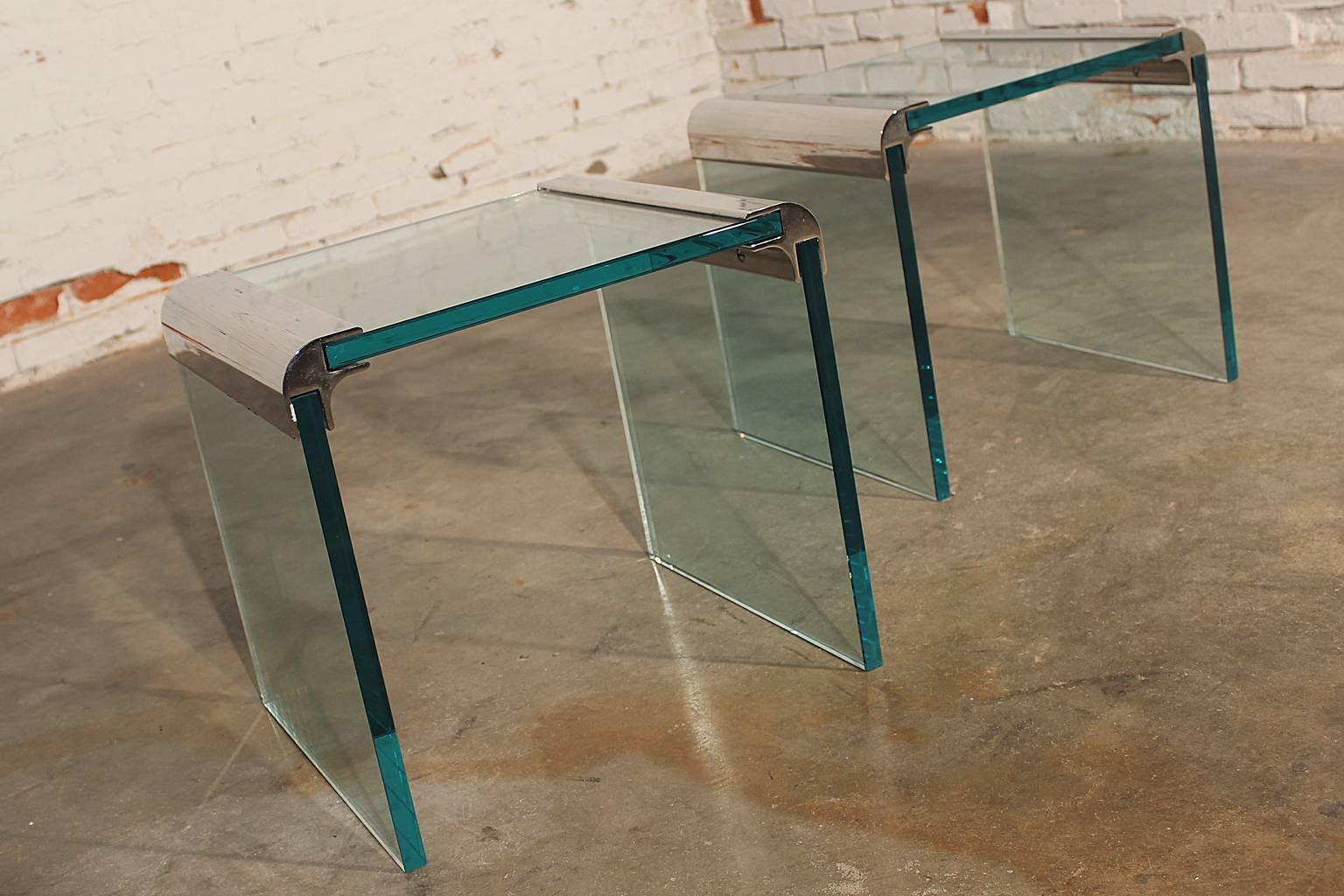 Fabulous pair of chrome and glass waterfall side tables by The Pace Collection, circa 1970s and in good vintage condition.

The Pace Collection provided high end contemporary furniture from 1960-2001. The company was founded by Irving and Leon