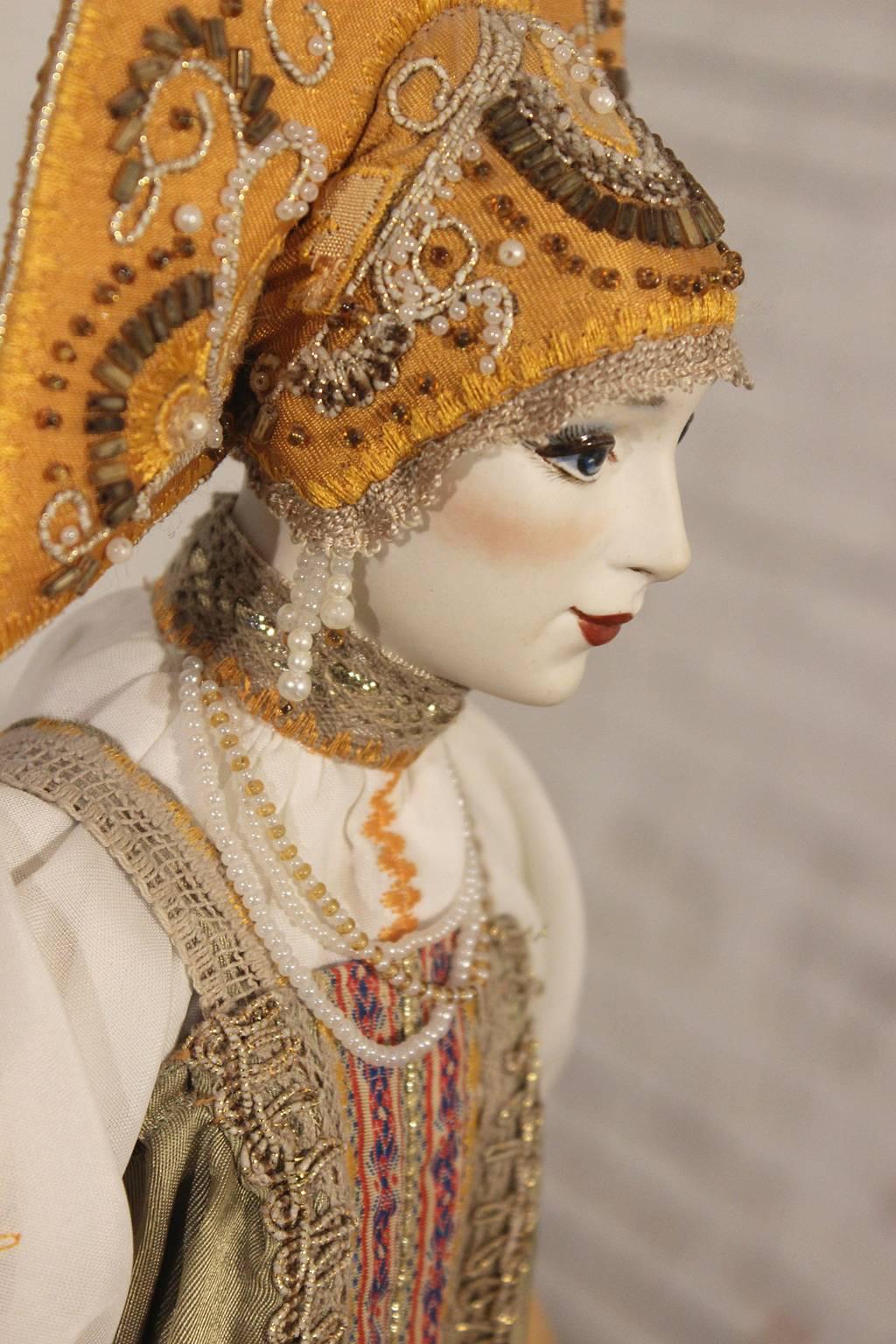 This Russian folk costume doll is a beautiful piece of Russian art in excellent condition.

What a beauty! There is no signature on her but through research we feel she must be made by Elena Pelevina or Natalia Vlasova. She is dressed in a very