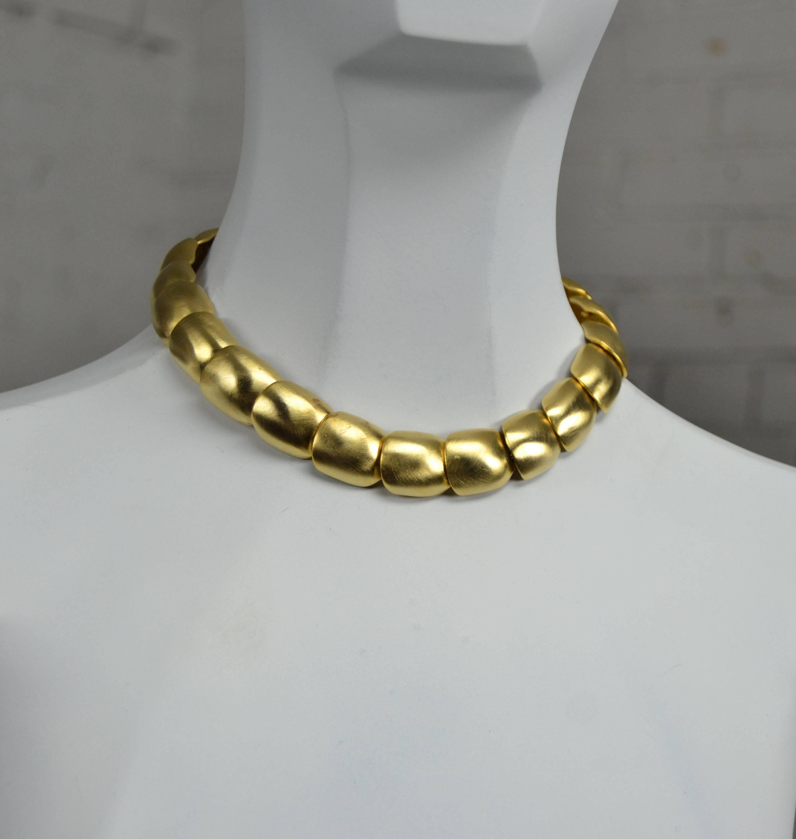 Stunning circa 1990s gold-tone choker necklace and cuff bracelet with brushed or matte finish by Clara Studio Inc. The set is in wonderful vintage condition. See long description for details.

What a gorgeous choker necklace and bracelet circa