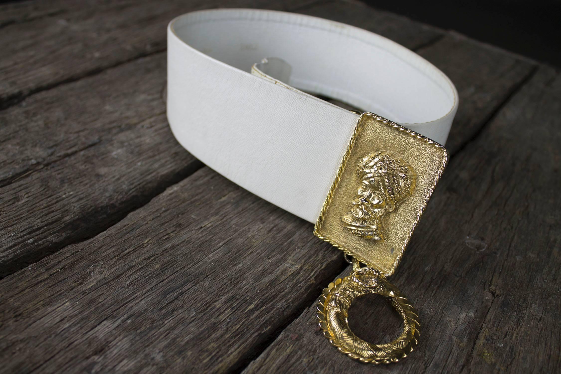 Fabulously fantastic vintage 1960s-1970s white leather belt with turbaned sultan and ram's head dangle ornament buckle. This belt is in wonderful vintage condition.

This is such an incredible Christian Dior belt! The belt itself is beautiful