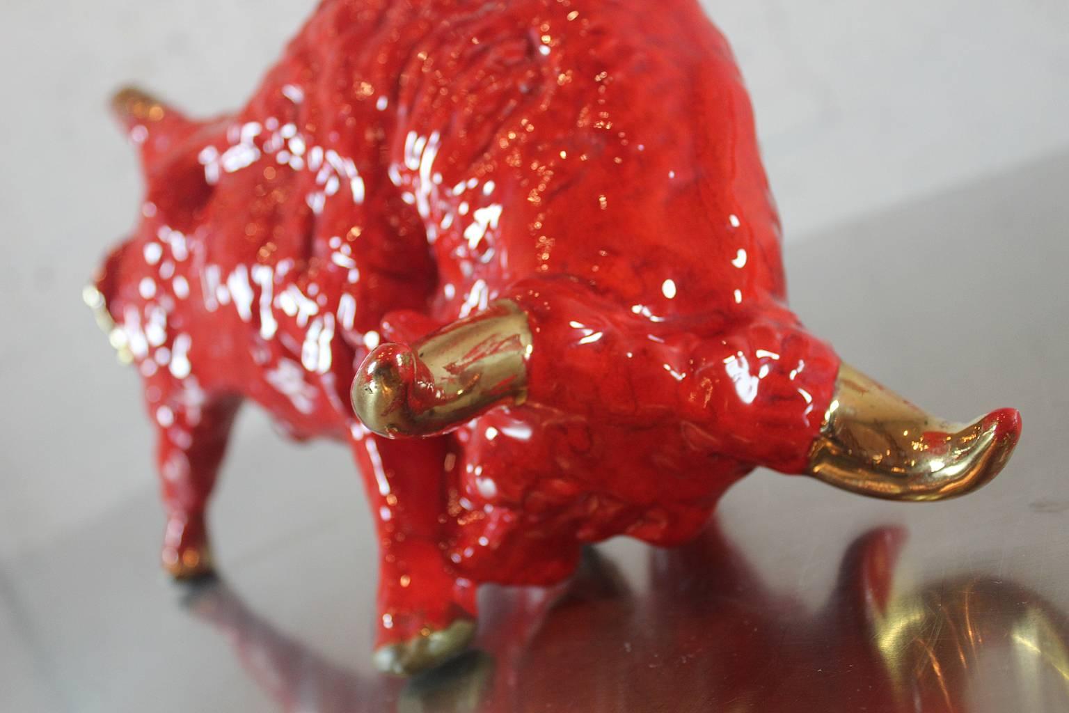 Here they are!! Vintage Royal Haeger style red ceramic bulls. What fantastic Bovine!!! These bulls are not signed but they are a wonderful example of 1950s figural pottery and very Royal Haeger-like. Bright red orange with gold tail, horns and