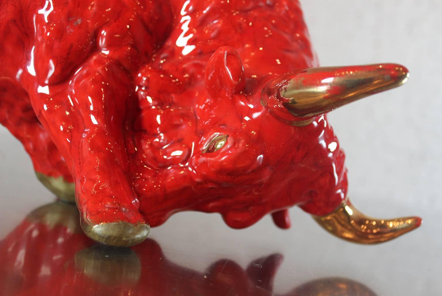 red ceramic bull with gold horns