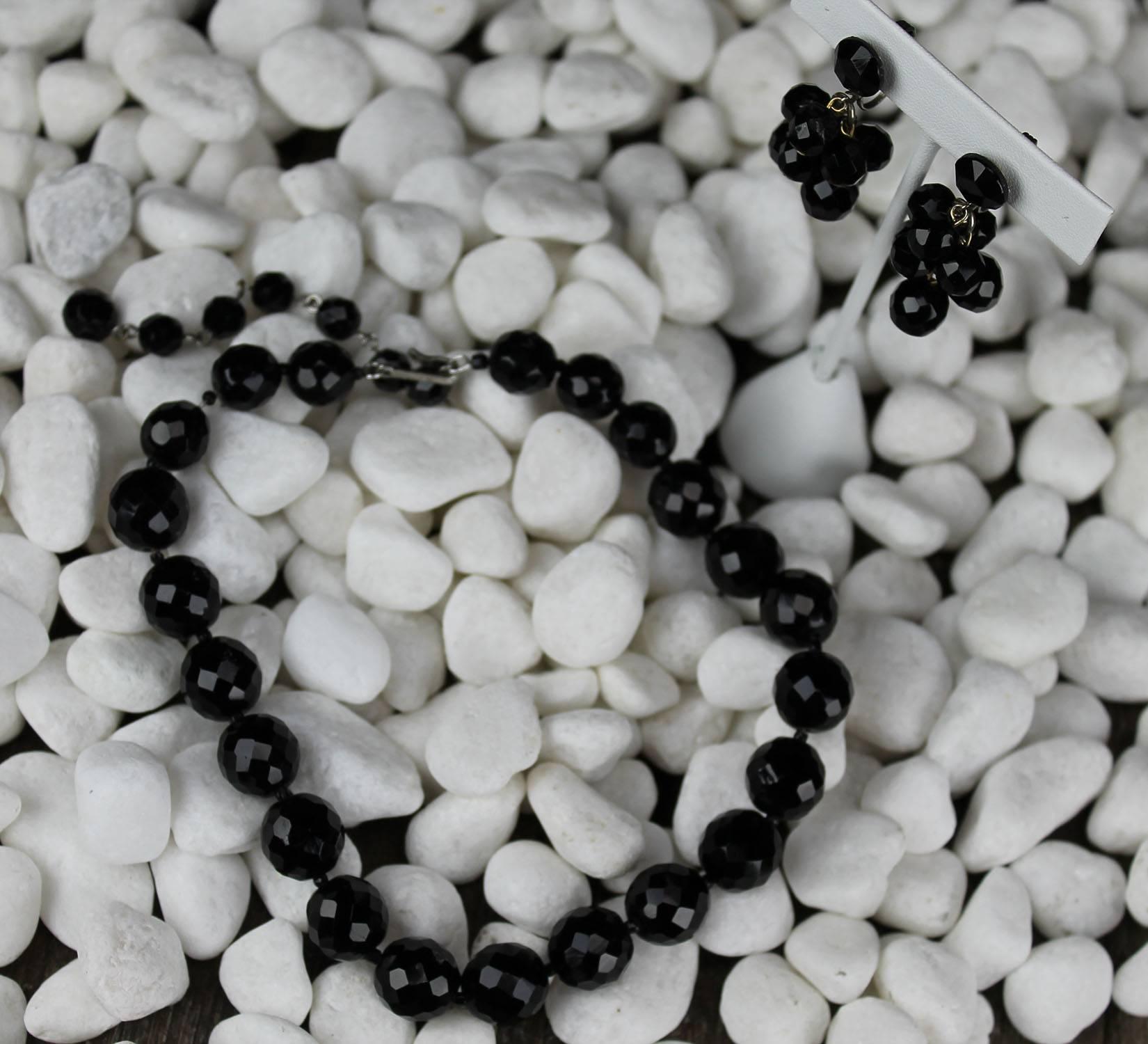Beautiful and Classic jet black faceted glass bead choker necklace and dangle earrings by Hobé. The set is in wonderful vintage condition.

Incredible! Just take a close look at this wonderful, circa 1950s vintage Hobé jet black faceted glass