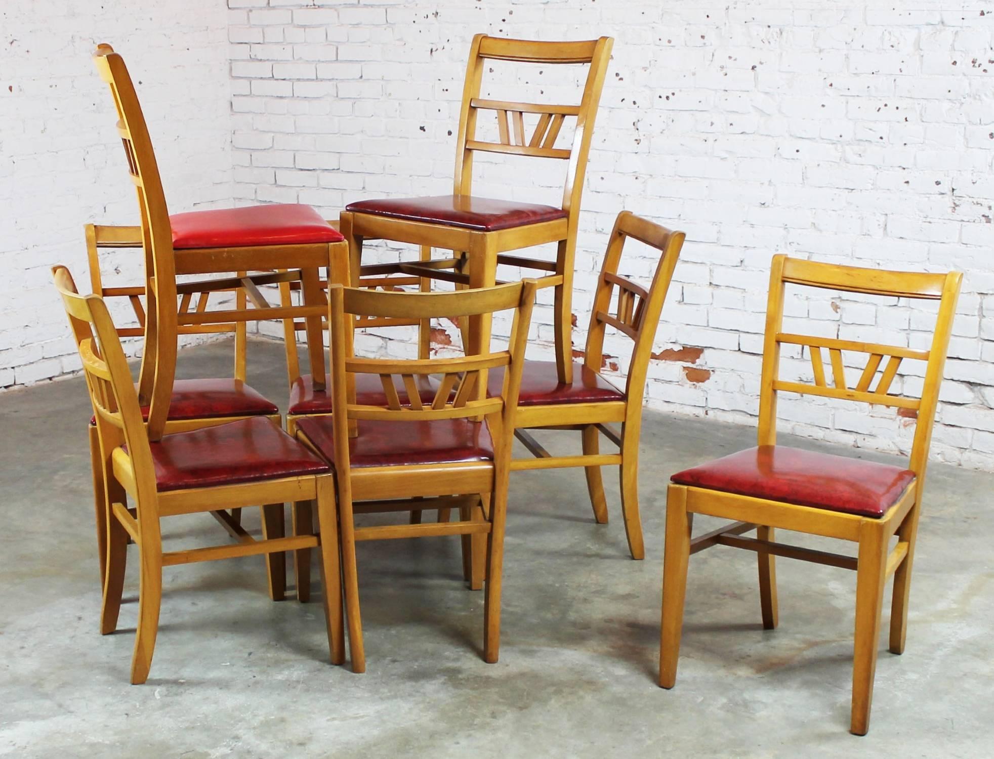 Fun set of eight Mid-Century dining chairs in mahogany. These chairs have great lines and lots and lots of potential. In good vintage condition.

Awesome set of eight light colored mahogany dining chairs from Mid-Century era. They are petite and