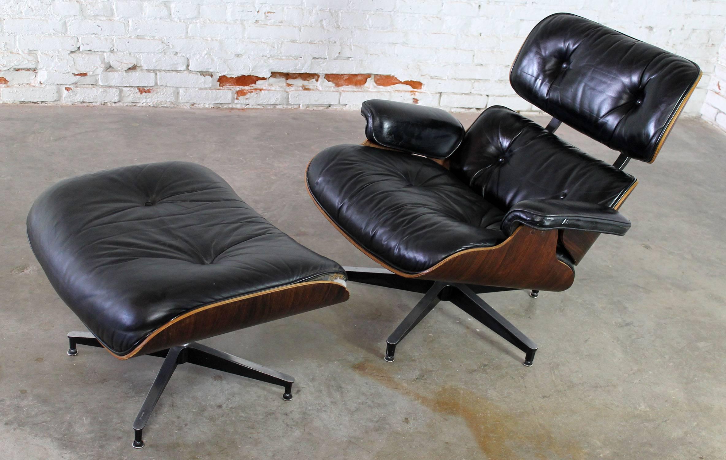 Iconic black leather and rosewood 670 and 671 Eames lounge chair and ottoman, circa 1971. This one has been used. Please read the long description for condition.

If you are looking for a pristine vintage Eames lounge chair and ottoman, this one