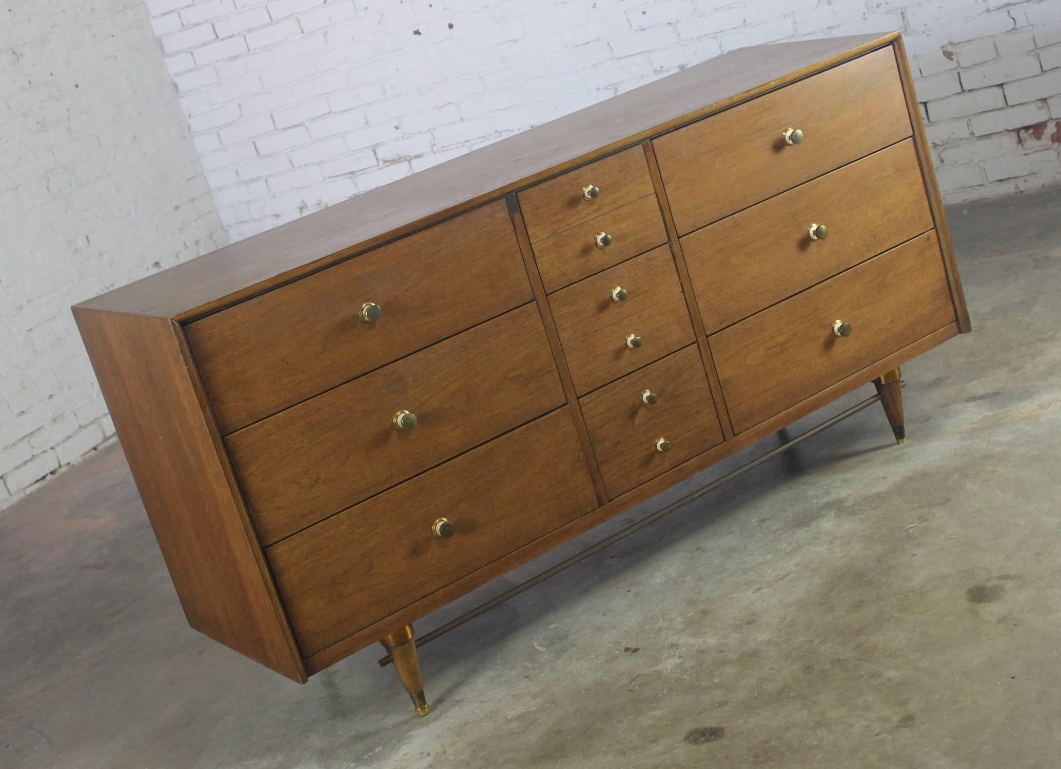 Great Mid-Century Modern chest with interesting brass trim and hardware made by The National Furniture Company, circa 1960. It is in wonderful vintage condition.

What a fabulous piece of Mid-Century Modern walnut, American made furniture! This