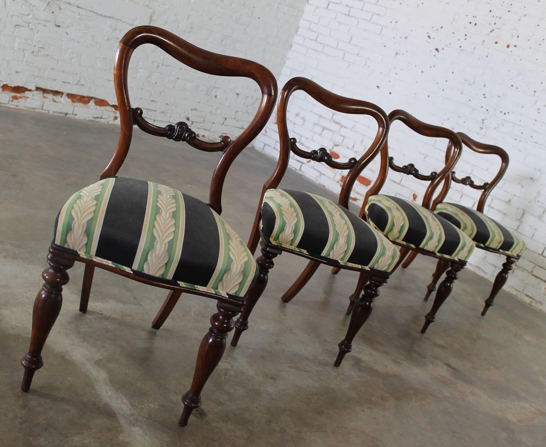 Set of four stately and elegant antique Victorian rosewood dining chairs in the manner of Gillows. They are all in wonderful condition, recently upholstered and ready to use.

Beautiful set of four antique Victorian rosewood dining chairs in the