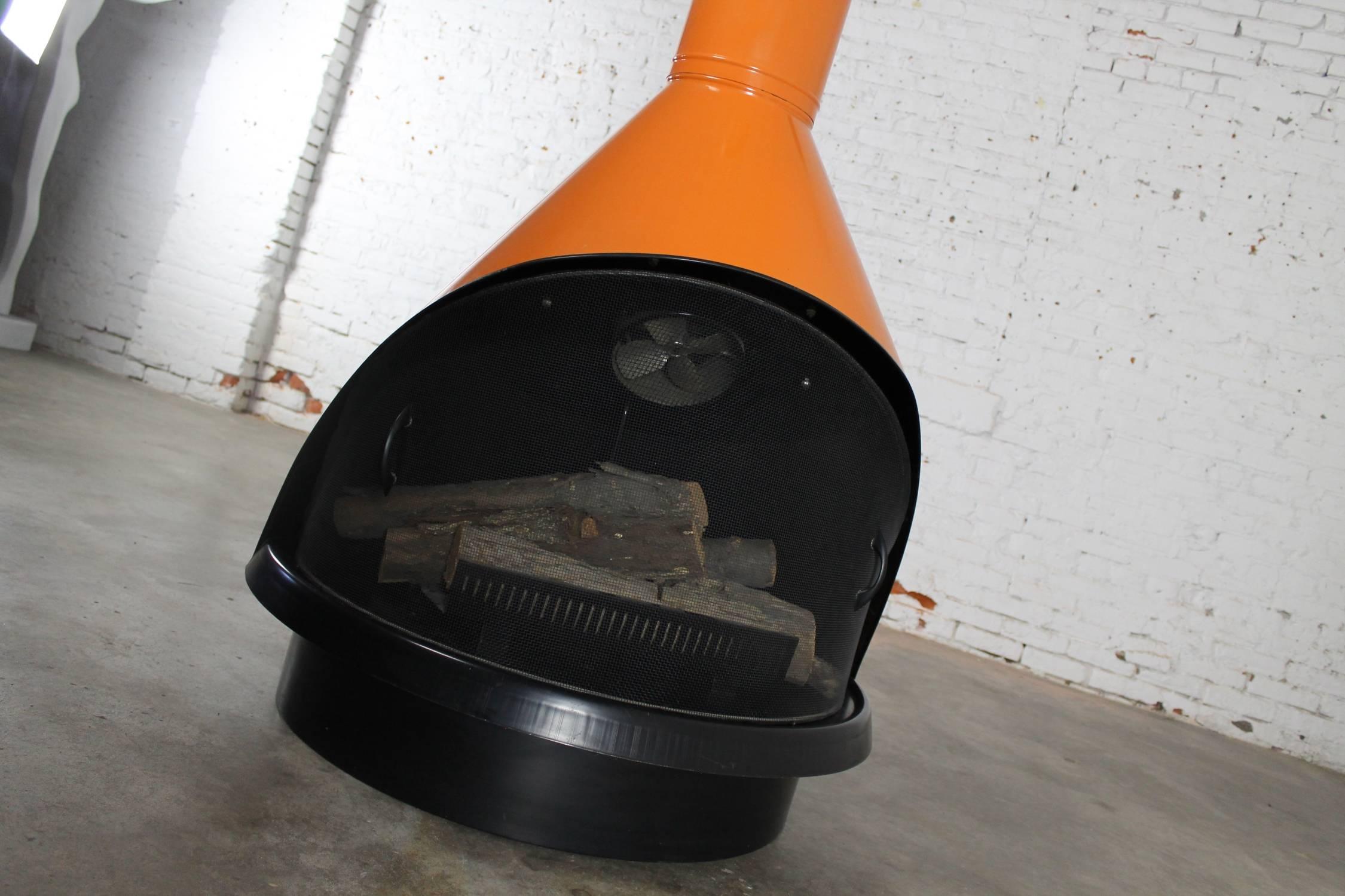 Incredible vintage retro mod Mid-Century Modern working fully electric faux fireplace in the style of Wendell Lovett, Preway, or Malm. Bright orange with black accents and sold by Sears. It is in wonderful vintage condition.

OMG!!! This retro