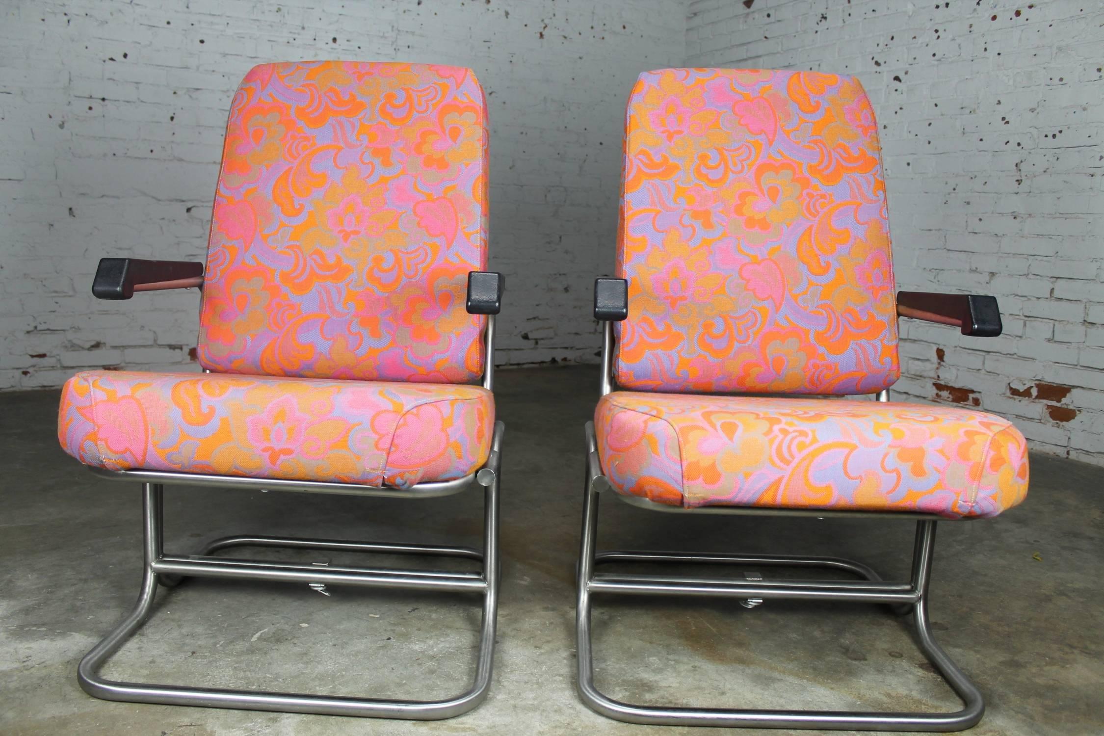 Just look at this fabulous pair of original circa 1960s Mid-Century Modern lounge chairs from a Pullman train car! They fold to suitcase size for storage and are in near excellent condition with their original mod fabric and stainless steel