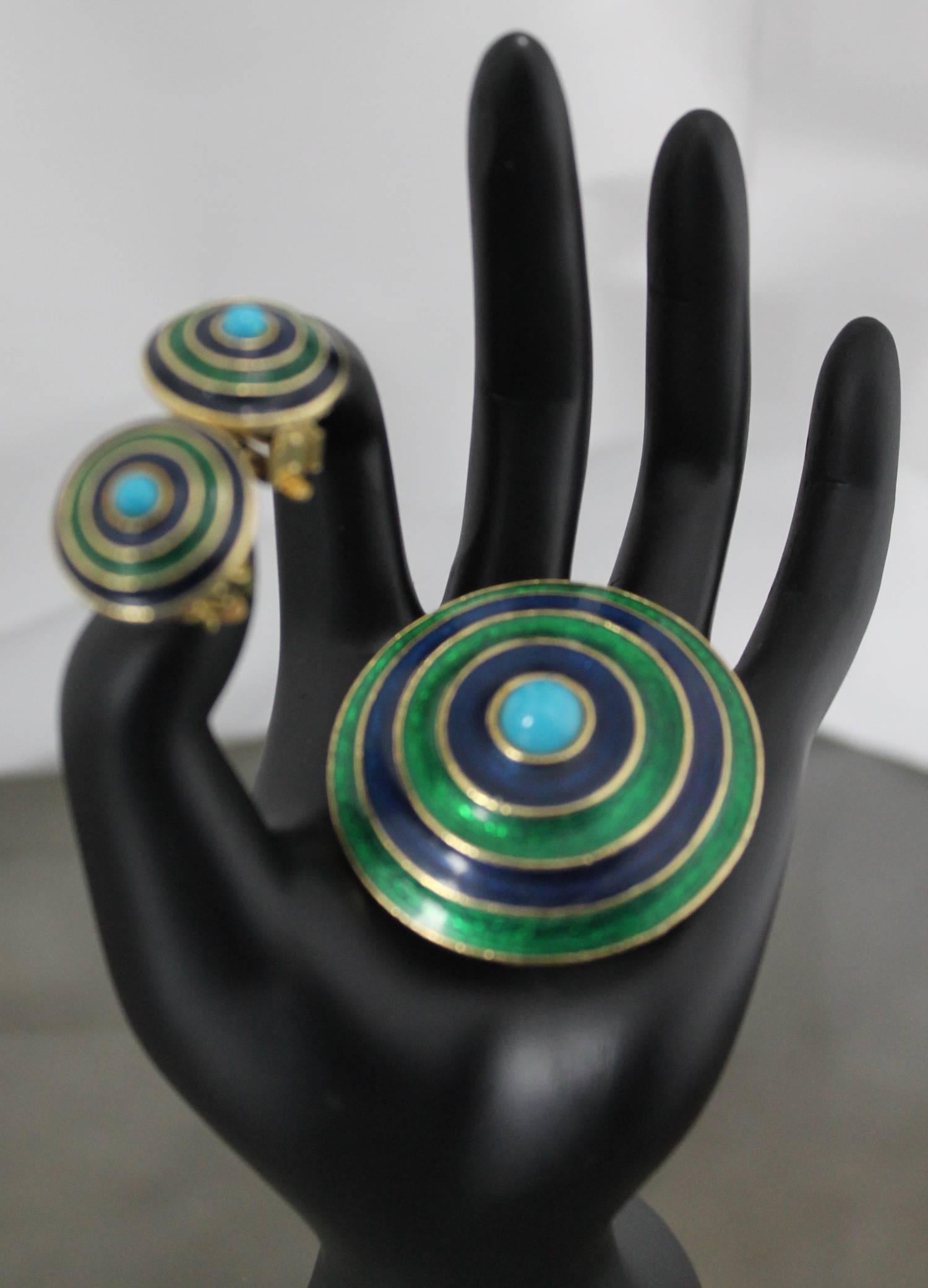 Excellent demiparure set of brooch and clip earrings by Florenza. Consisting of enameled concentric circles of blue and green with gold-tone accent and faux turquoise. The set is in excellent vintage condition and marked with the block lettering of