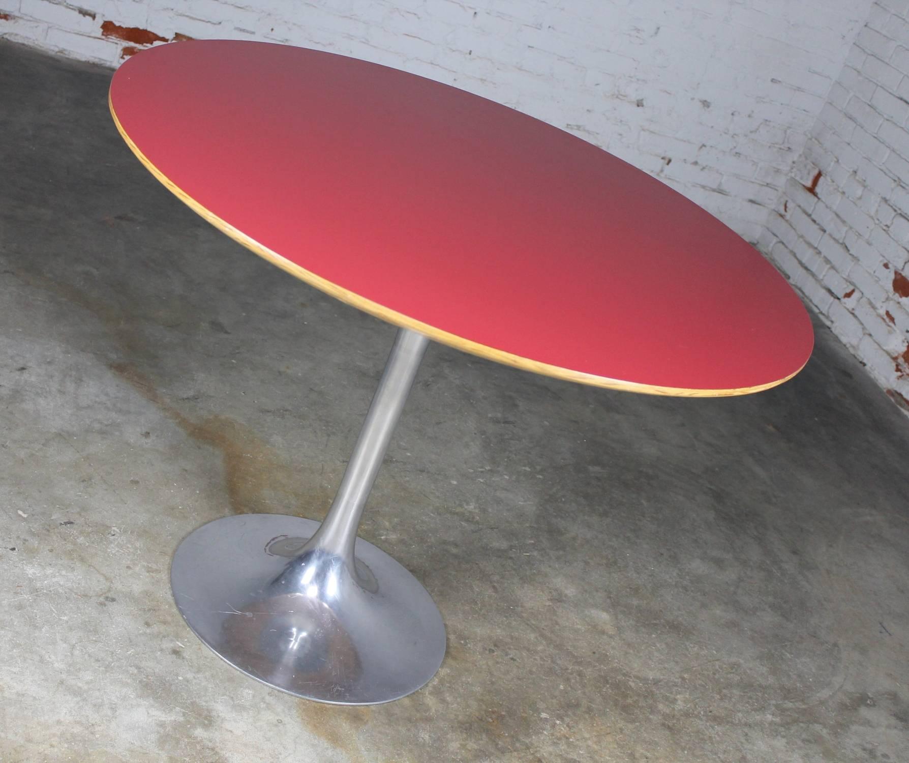 Awesome vintage Saarinen-style tulip base dining table. The base is polished alunimum and most likely Burke. The top is a relatively newly made top in a vintage style using red formica or laminate and plywood with a back-beveled edge. This table is