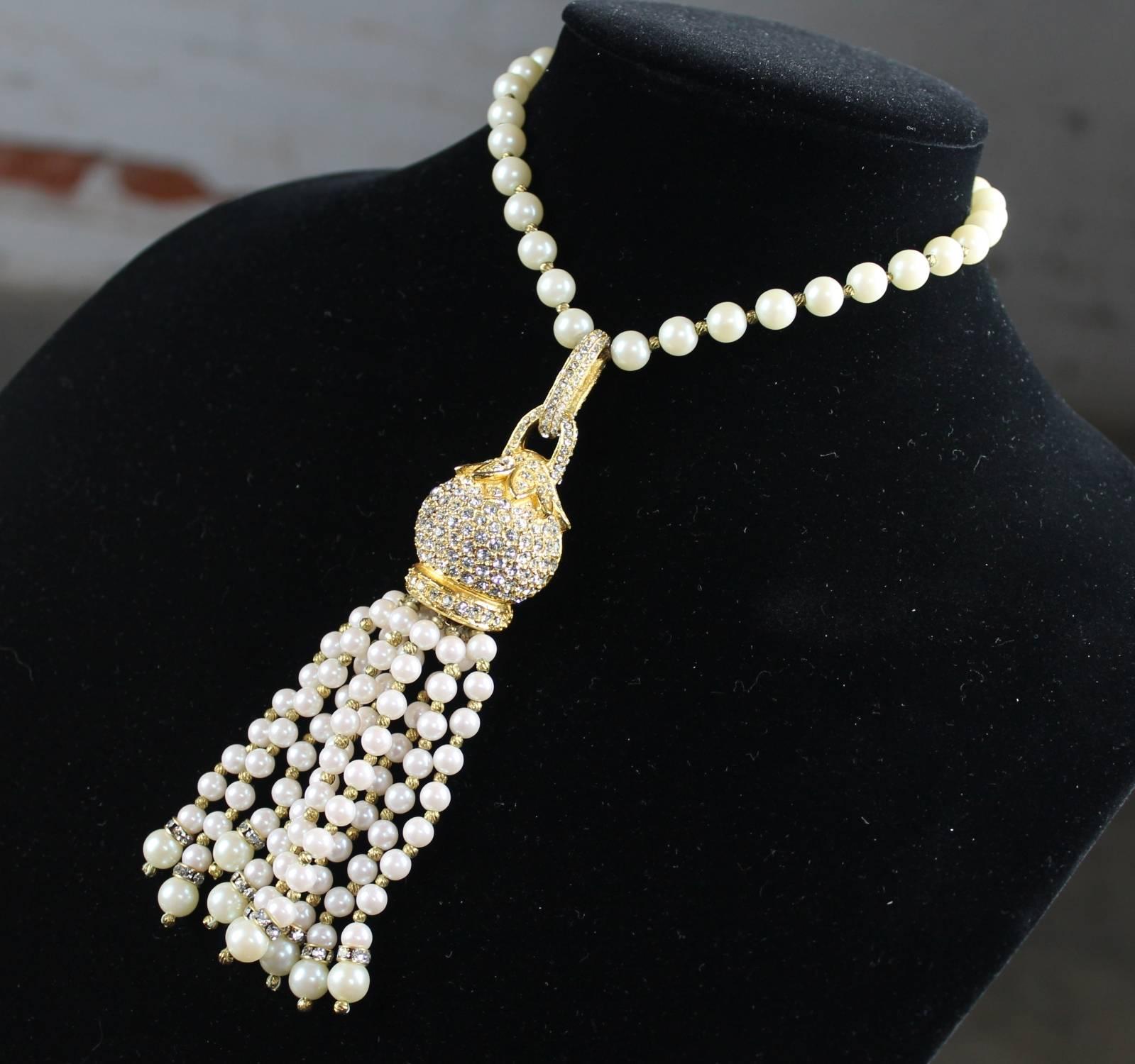 Magnificent simulated pearl, gold-tone, and rhinestone choker necklace with large tassel by Cadoro © in like-new condition.

This faux pearl and rhinestone choker necklace with its large tassel is an exceptional example of Cadoro jewelry. This