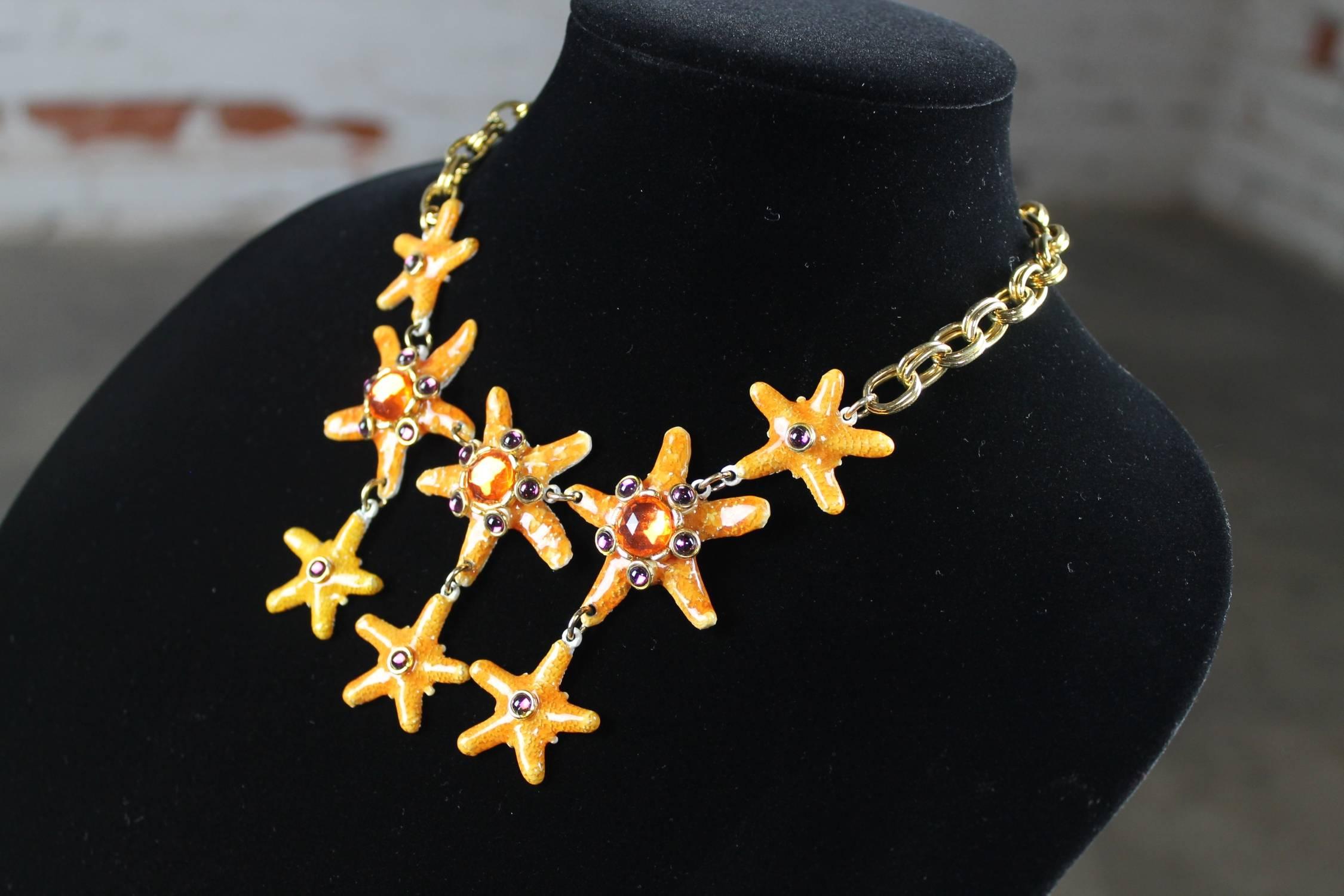 Absolutely stunning bib necklace by Gem-Craft Corp and signed Craft © consisting of eight bejeweled starfish on a chain. It is in very good vintage condition with no missing jewels.

This vintage bib style necklace consisting of eight wonderful