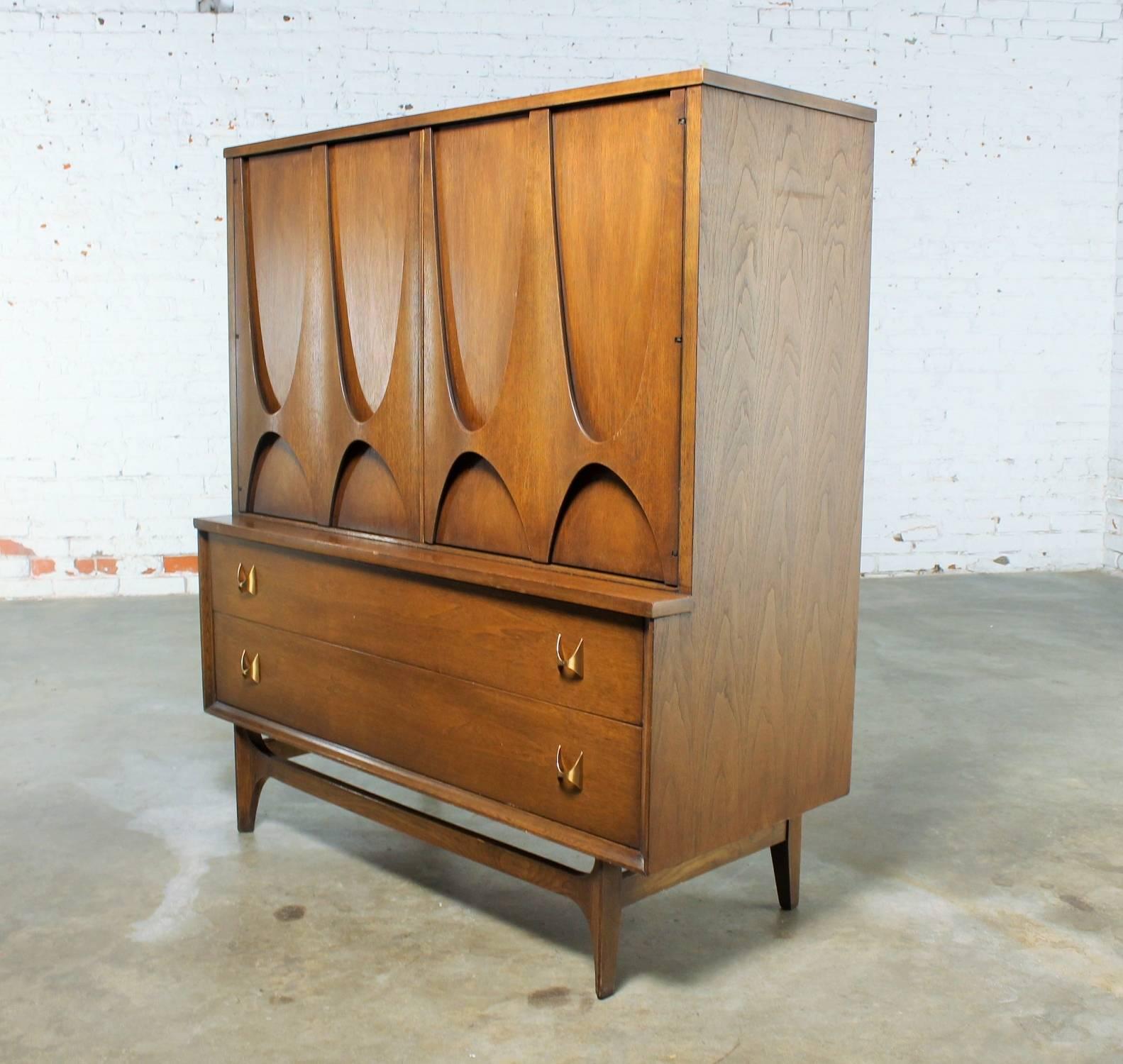 Incredible Mid-Century Modern, 6130-41 walnut door chest or gentleman’s chest from the Brasilia collection by Broyhill Premier. This chest is beautiful original condition.

We stumbled across some marvellous pieces from the Broyhill Premier