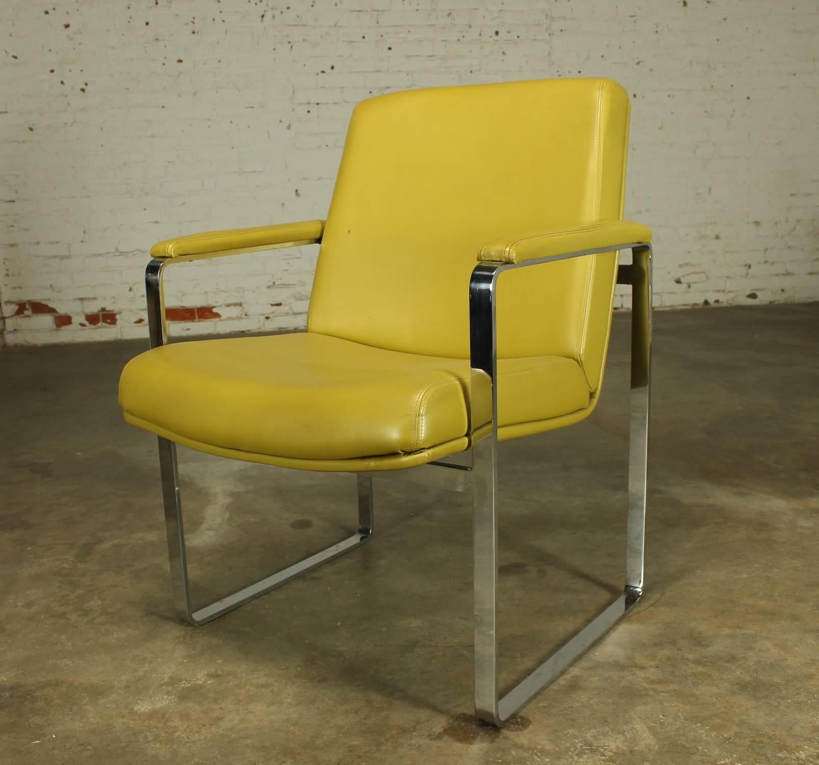 Wonderful Chromcraft-style Mid-Century Modern flat-bar chromed steel chair in gold vinyl. The chrome is in fabulous condition and the vinyl upholstery is in good condition, there is a small puncture on the side of the right arm cover. Please see