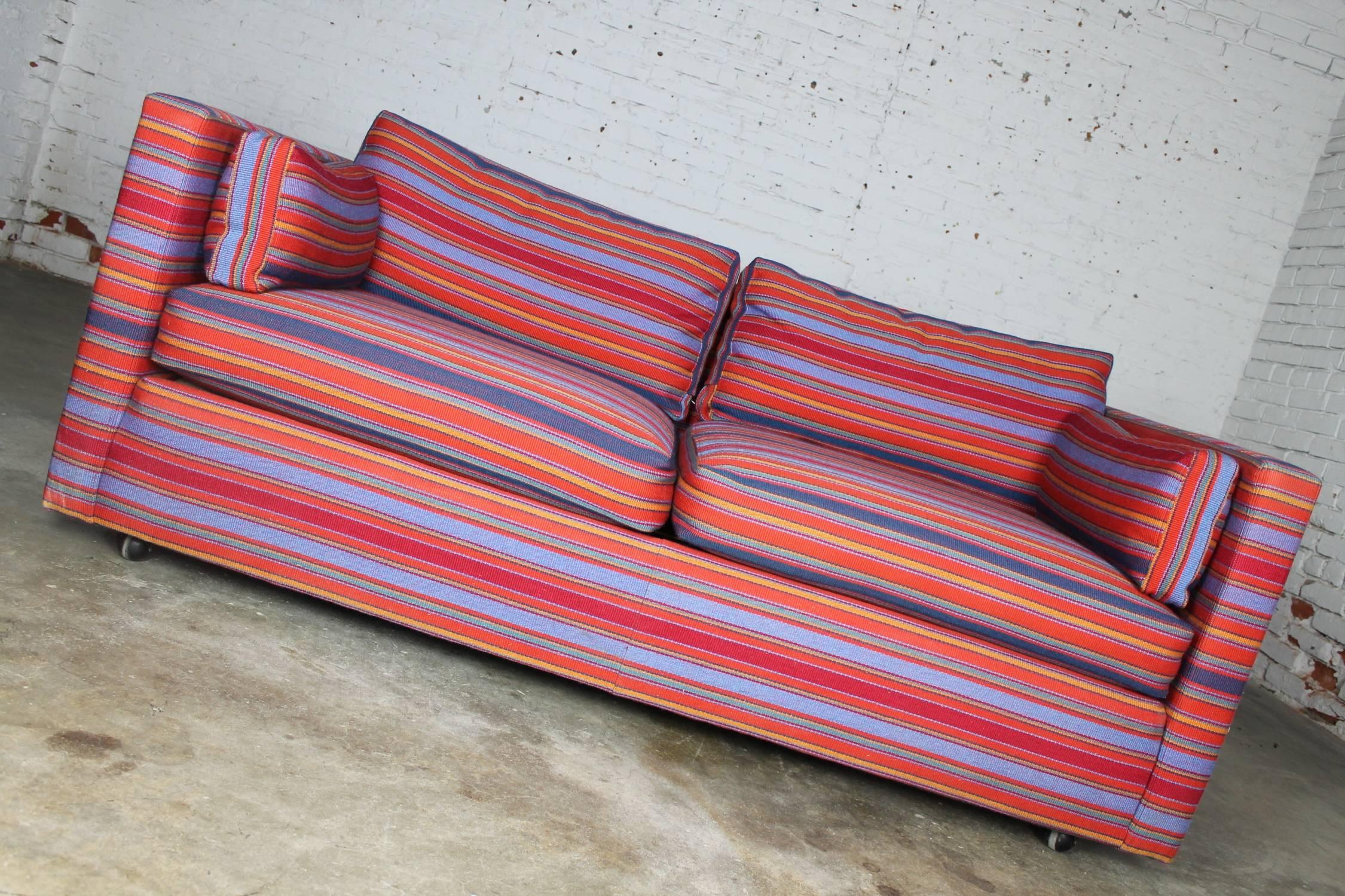 Handsome Mid-Century Modern Harvey Probber style tuxedo loveseat length sofa in striped Jack Lenor Larson style fabric. It is in wonderful vintage condition. The fabric looks like new.

This is such an awesome sofa in a fabulous fabric and a great