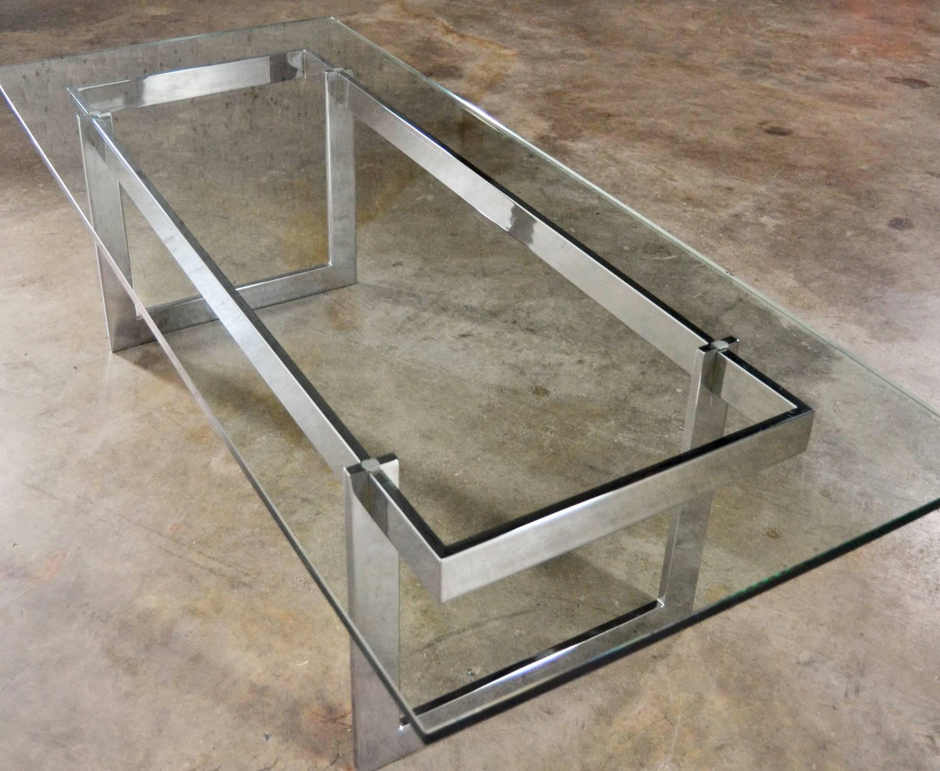 Fabulous rectangular chrome and glass Mid-Century Modern coffee table in the style of Milo Baughman. This circa 1970s coffee table is in wonderful vintage condition. Couldn’t identify this coffee table’s maker but it is done in the style of Milo
