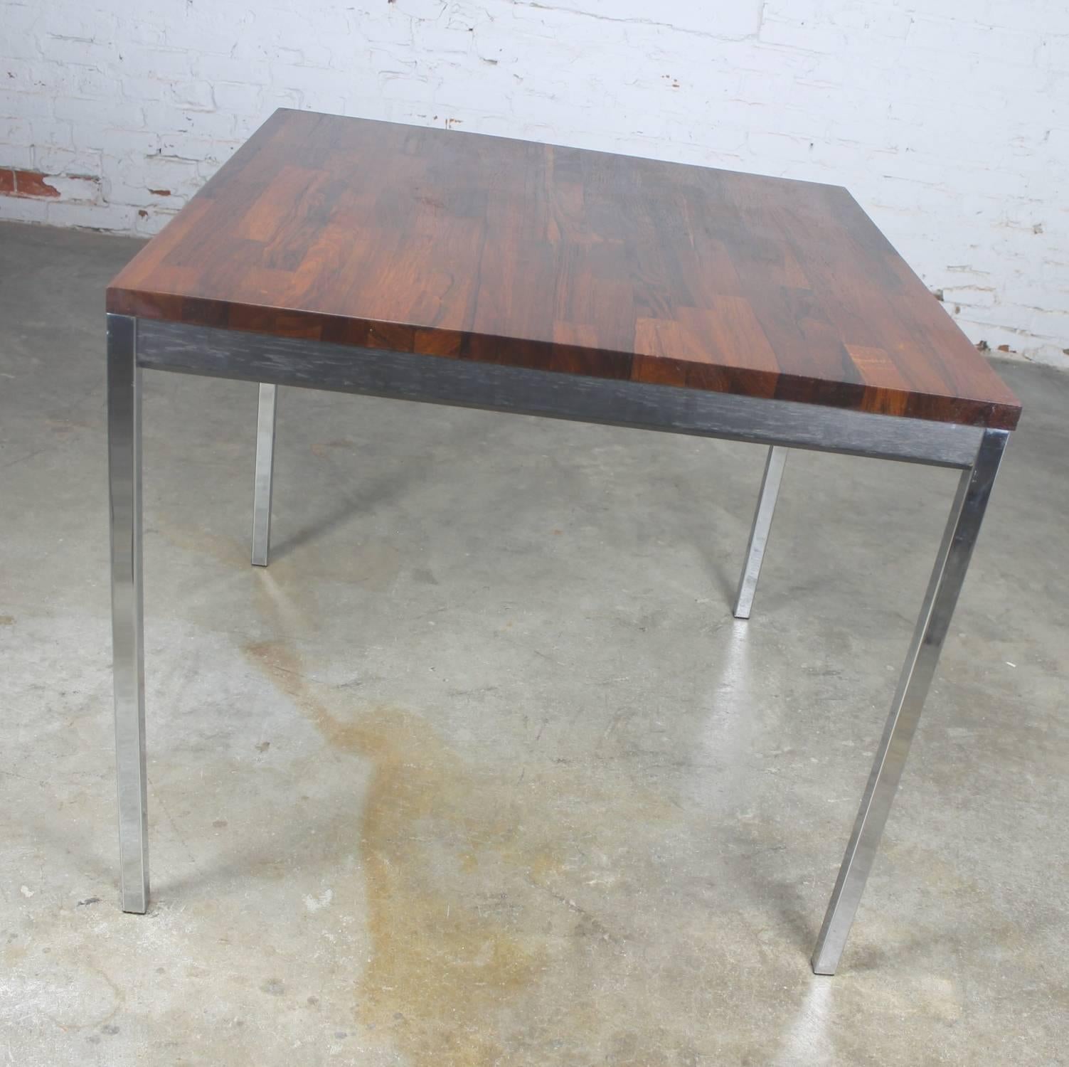 Outstanding vintage Mid-Century Modern square card table in the style of Milo Baughman or Knoll with chrome legs, staved rosewood top, and ebonized wood apron. It is in incredible vintage condition circa 1970.

This oh so handsome table is a feast