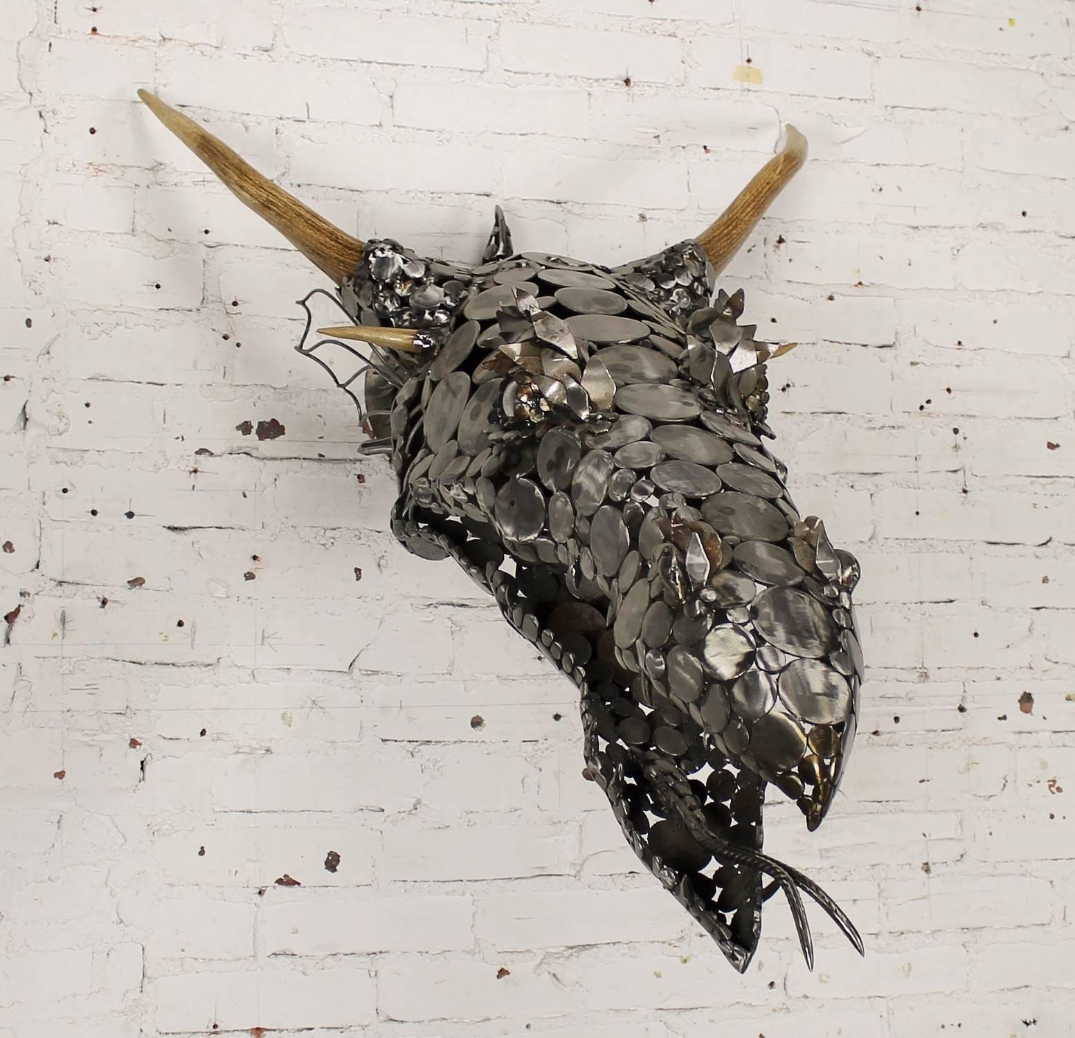 Absolutely fantastic dragon head wall sculpture by Jason Startup of Topeka, Kansas. Consisting of welded scrap metal pieces and deer antler. This piece is circa 2015.

I am so in love with this magnificent dragon sculpture!! I hope our photos do