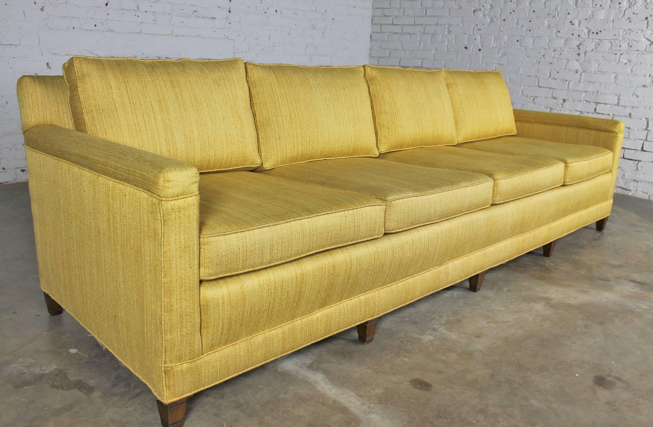 Beautiful golden yellow Mid-Century sofa in Lawson style extra-long with four cushions. This circa 1960 sofa is in wonderful vintage condition.

This lovely golden yellow sofa is so comfortable and an extra-long 8+ feet for wonderful NAP taking!