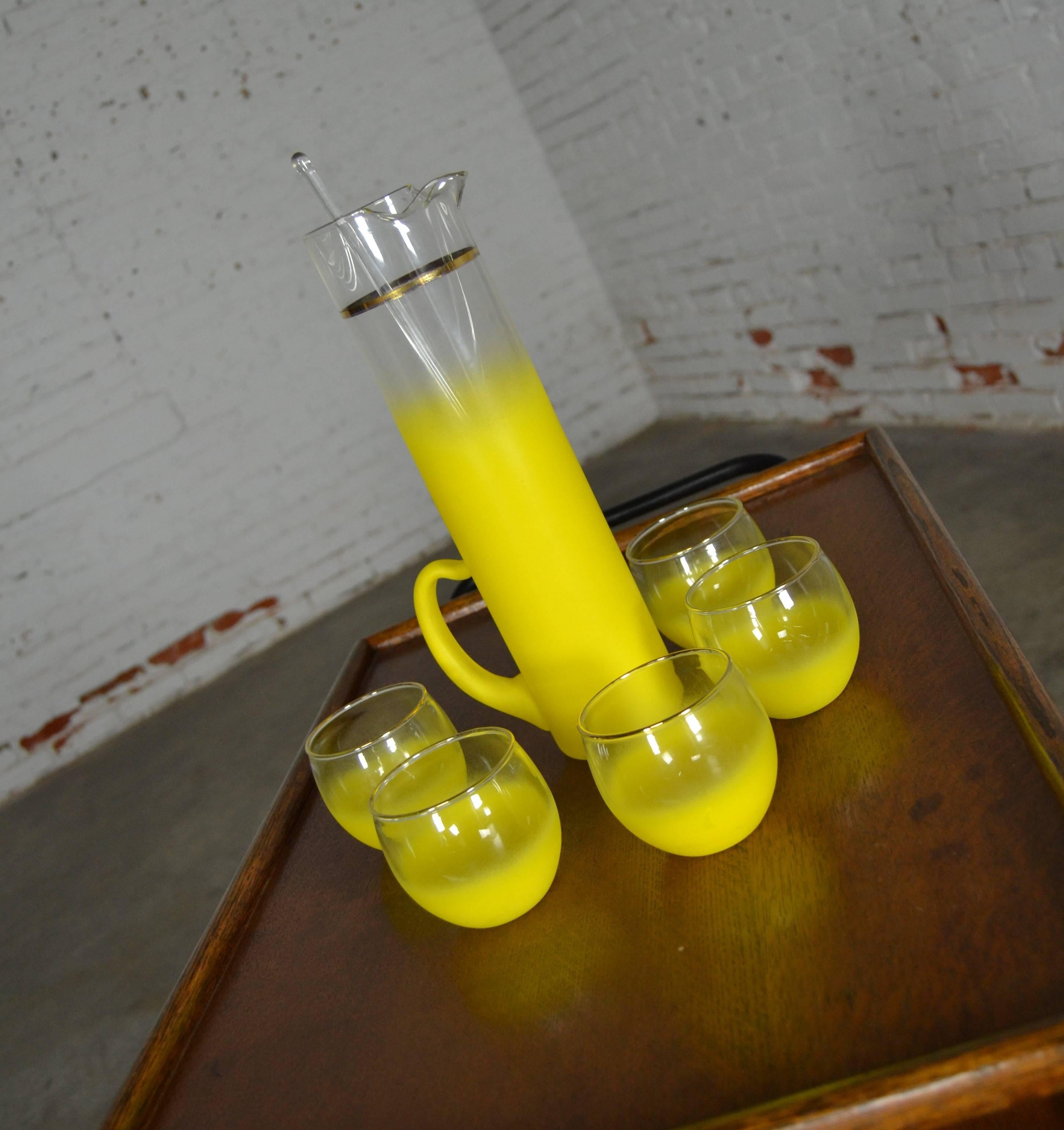 Sunshine yellow vintage Mid-Century Modern Blendo Glass collection juice or cocktail beverage set with pitcher and five glasses. Attributed to the West Virginia Specialty Glass Company and in wonderful vintage condition with no chips or cracks and