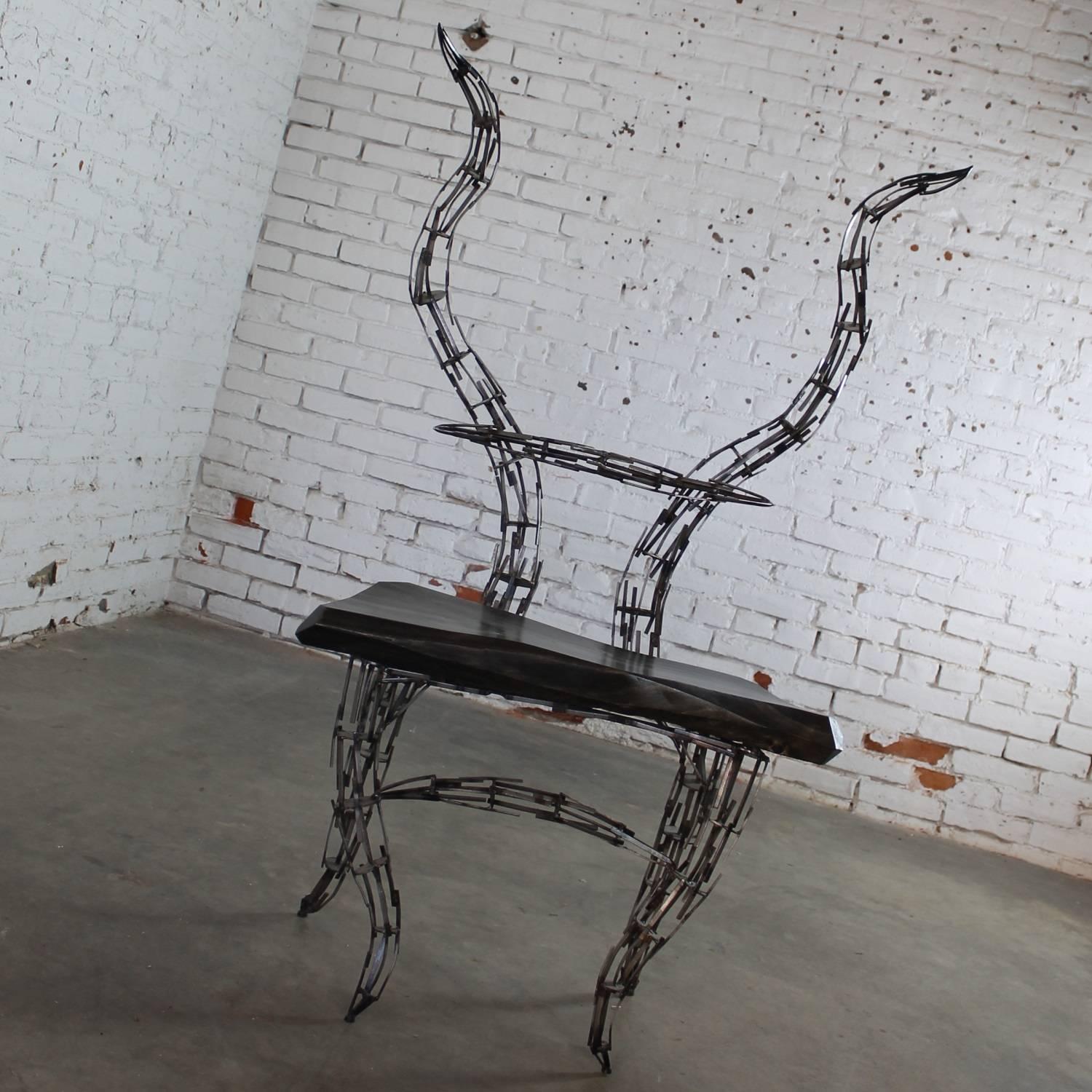 One of a kind sculptural chair of reclaimed scrap metal and wood titled “Borgantula” by Jason Startup. Wonderful Horn chair sculpture in new condition, circa 2017.

Not your mother’s side chair! This outstanding chair sculpture comes from the