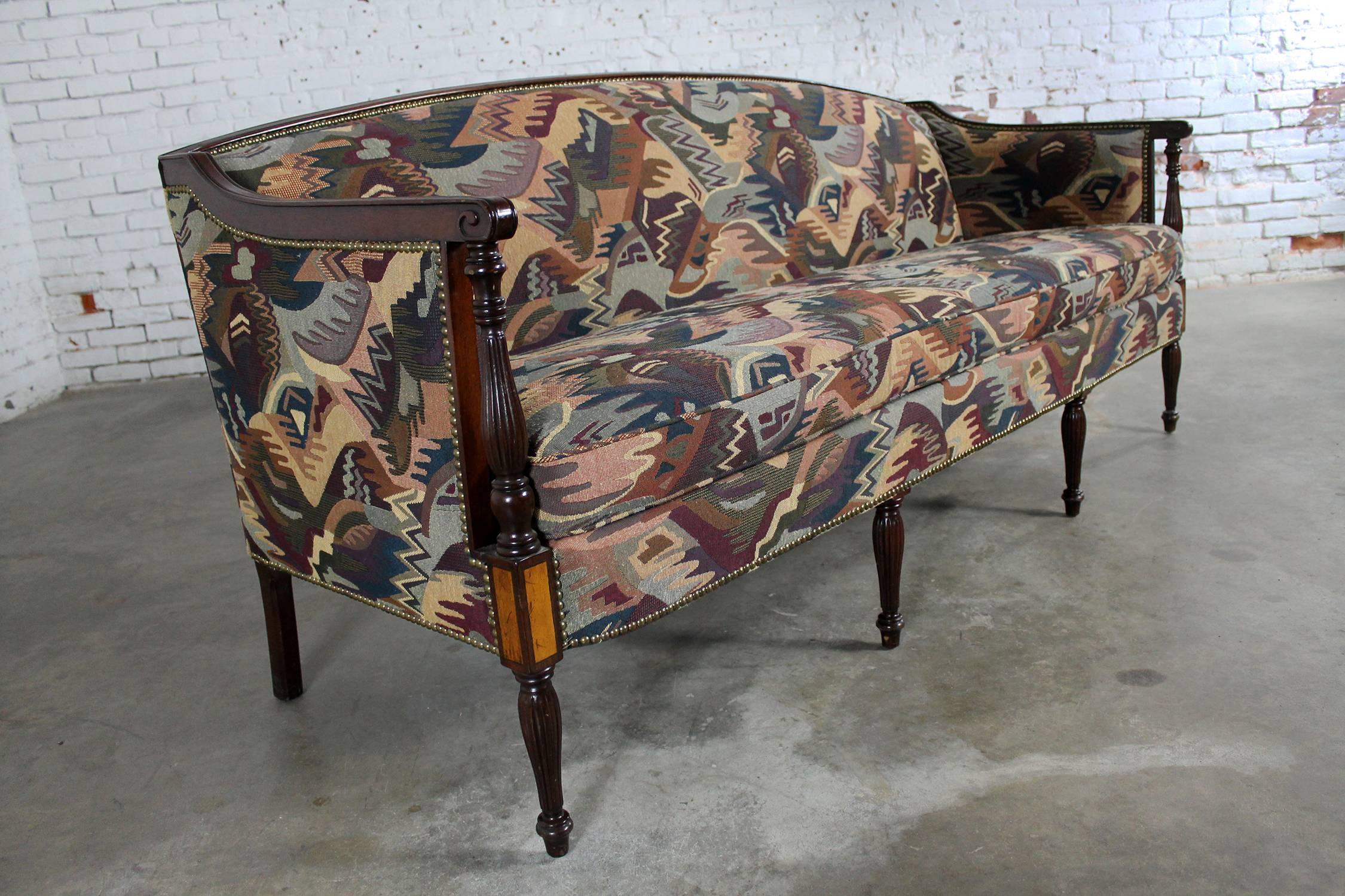 Gorgeous and unusual classical American Federal carved Sheraton style sofa or settee in fabulous abstract contemporary tapestry upholstery fabric. This piece is circa 1950s, redone in the 1990s, and in wonderful vintage condition.

Holy cow get a