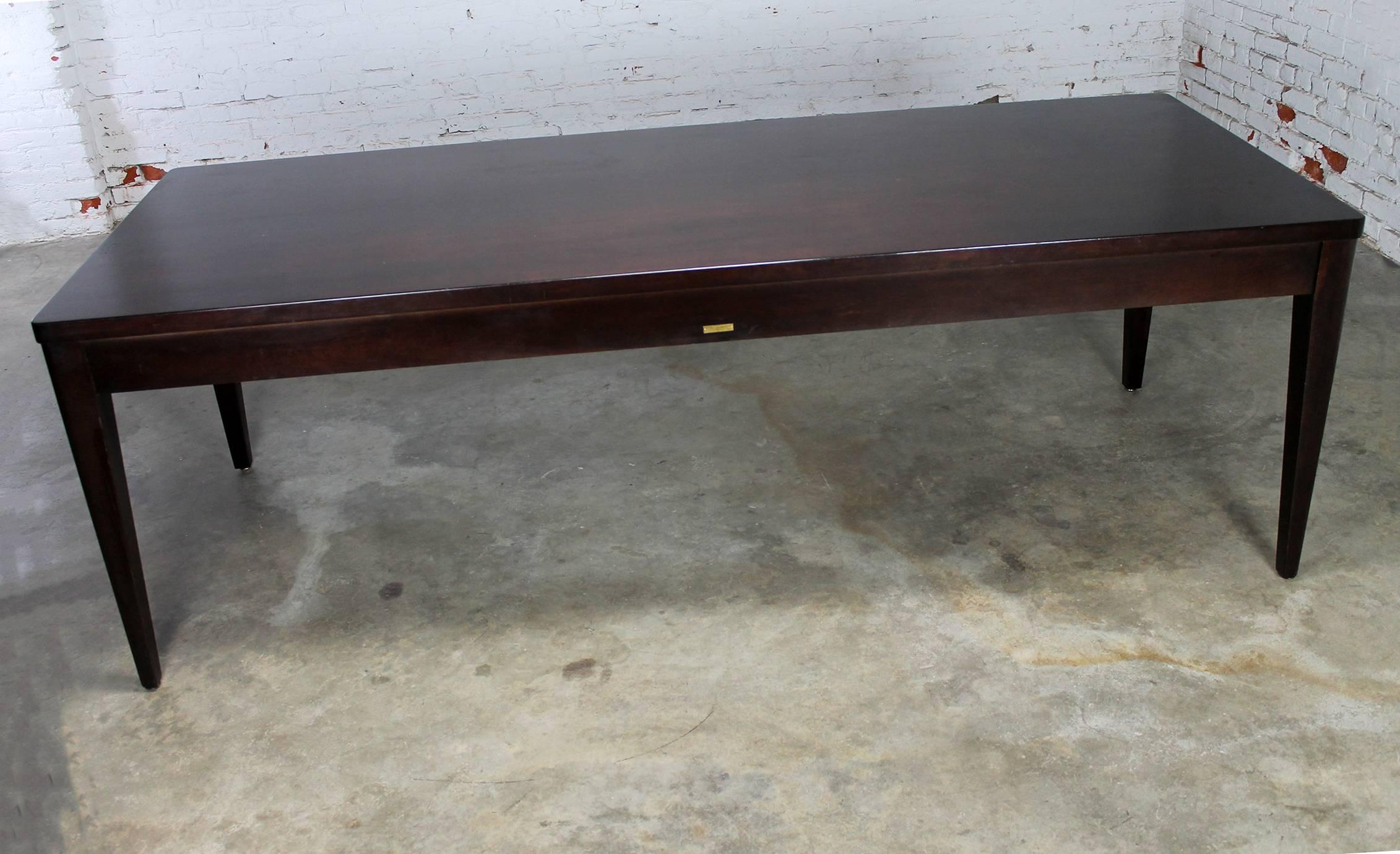 Gorgeous vintage Mid-Century library or schoolhouse style dining table made by Bro-Dart Industries, circa 1960. This maple table has been refinished at some point in its life and stained a beautiful dark espresso brown. It is in fabulous condition