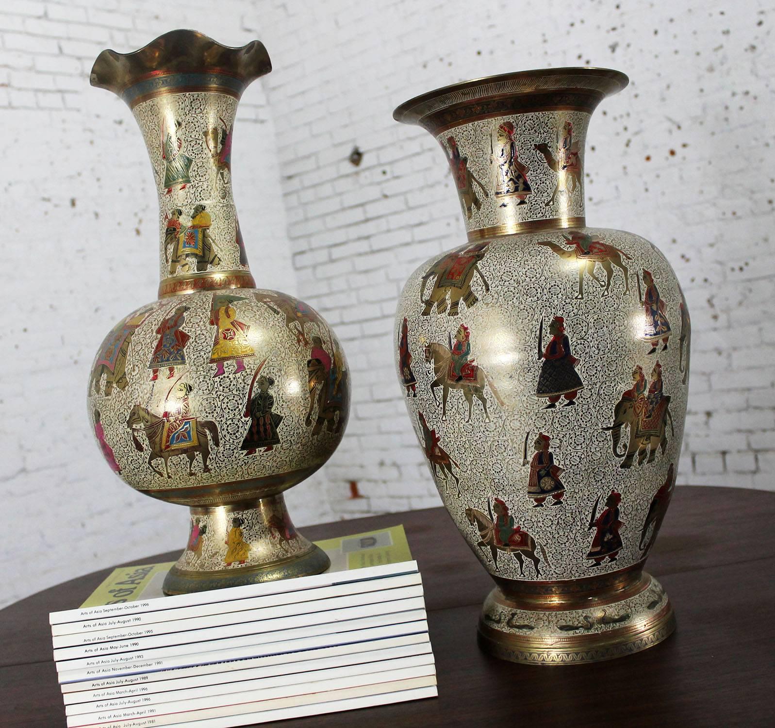 Monumental unmatched pair of vintage cast brass Kashmiri Indo Persian vases. Elegantly etched and enameled. In excellent condition, circa 20th century.

These extra-large cast brass vase is absolutely gorgeous! Although unmatched in shape, one is