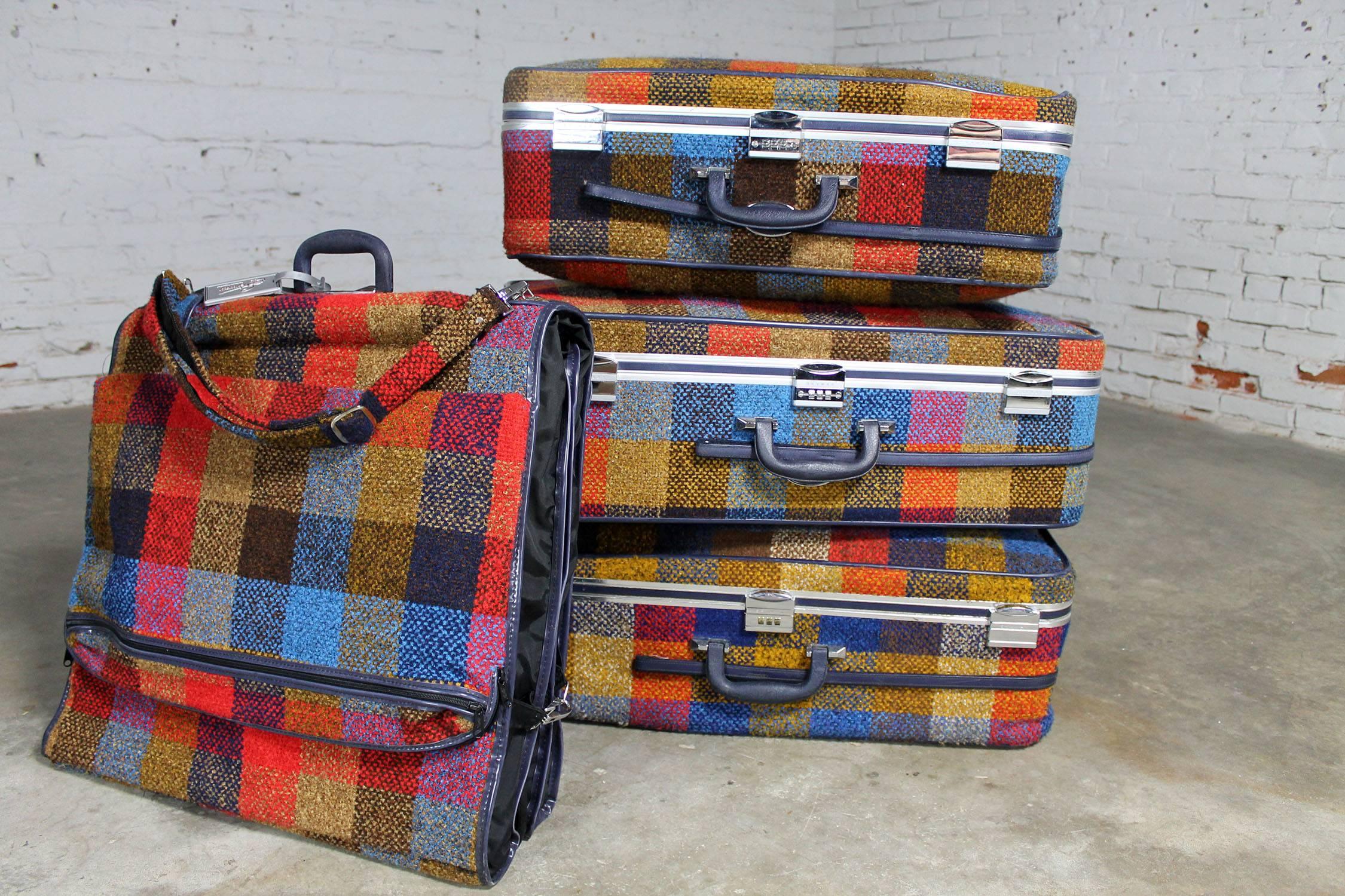 Awesome four-piece set of luggage by Skyway, circa 1970s. Mod bold and bright red, gold, and blue plaid. In incredible condition.

All my bags are packed, I’m ready go. I’m leaving on a jet plan. Oh! Hello! Aren’t these the coolest suitcases?