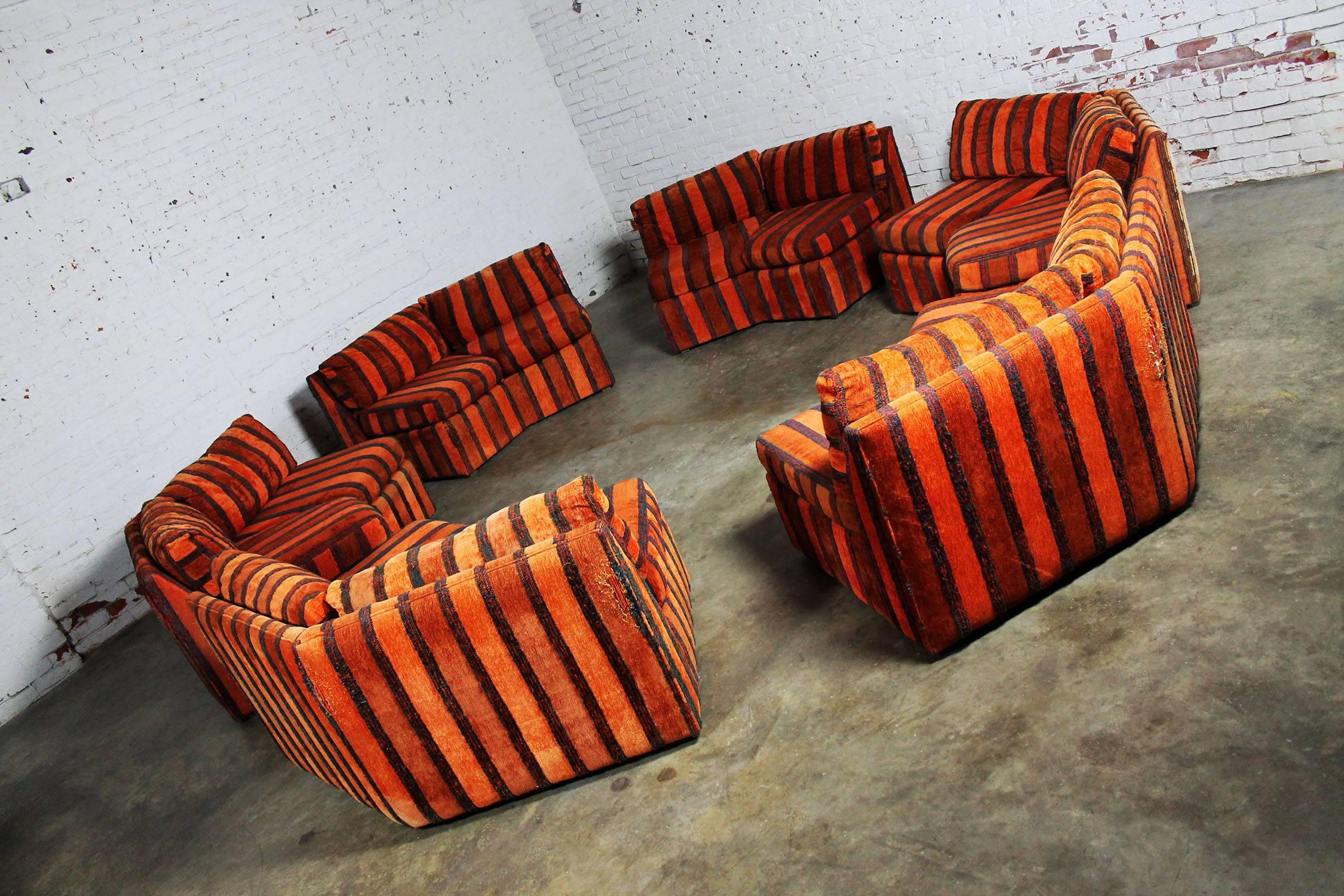 Incredible six-piece curved, circular, hexagonal sectional sofa by Bernhardt Ind. for their Flair Collection in the style of Milo Baughman. This sofa is in “needs to be recovered” condition. The bones are good but the fabulous orange and blue/black