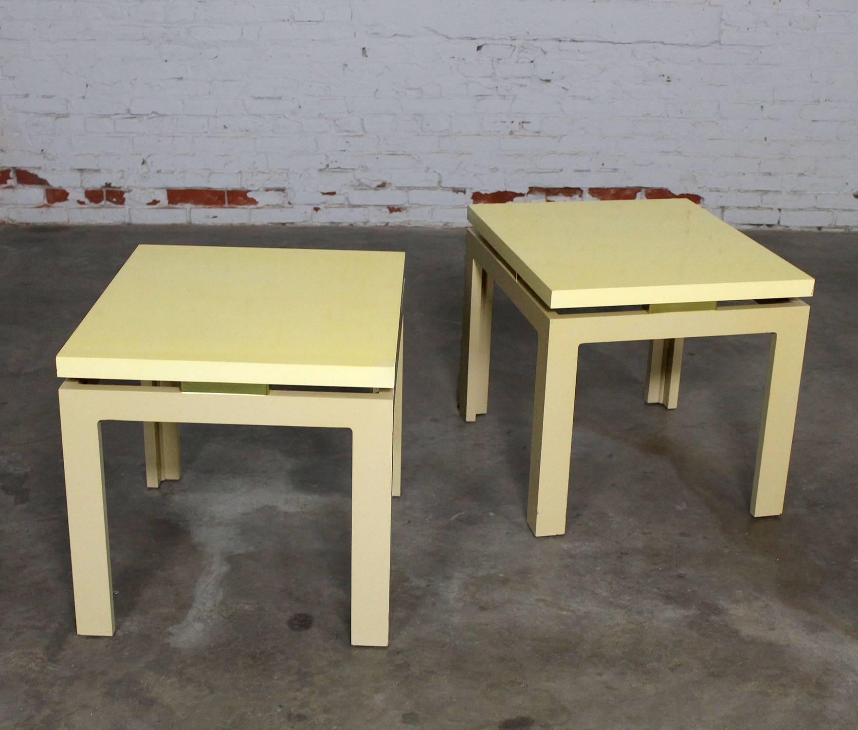 Awesome pair of off-white lacquered Parsons side tables with brass spacer detail and floating top. They are rectangular and in wonderful vintage 1970s condition. There are small nicks and dings to the lacquer but nothing major to detract from their