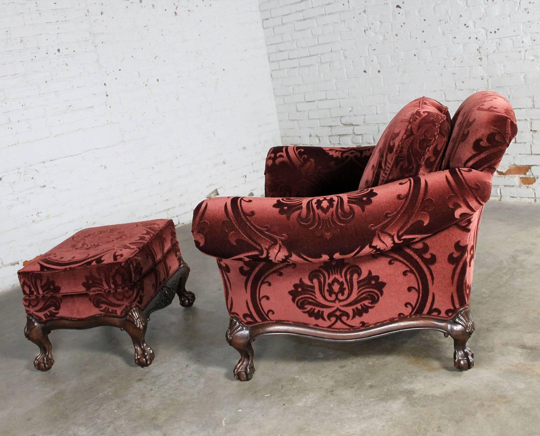 Over scaled and oh so handsome lounge or club chair and ottoman by Hancock and Moore. Upholstered in the most gorgeous burgundy sculpted mohair I have ever seen which beautifully accents the ball and claw feet, circa 1990s and in fabulous like-new