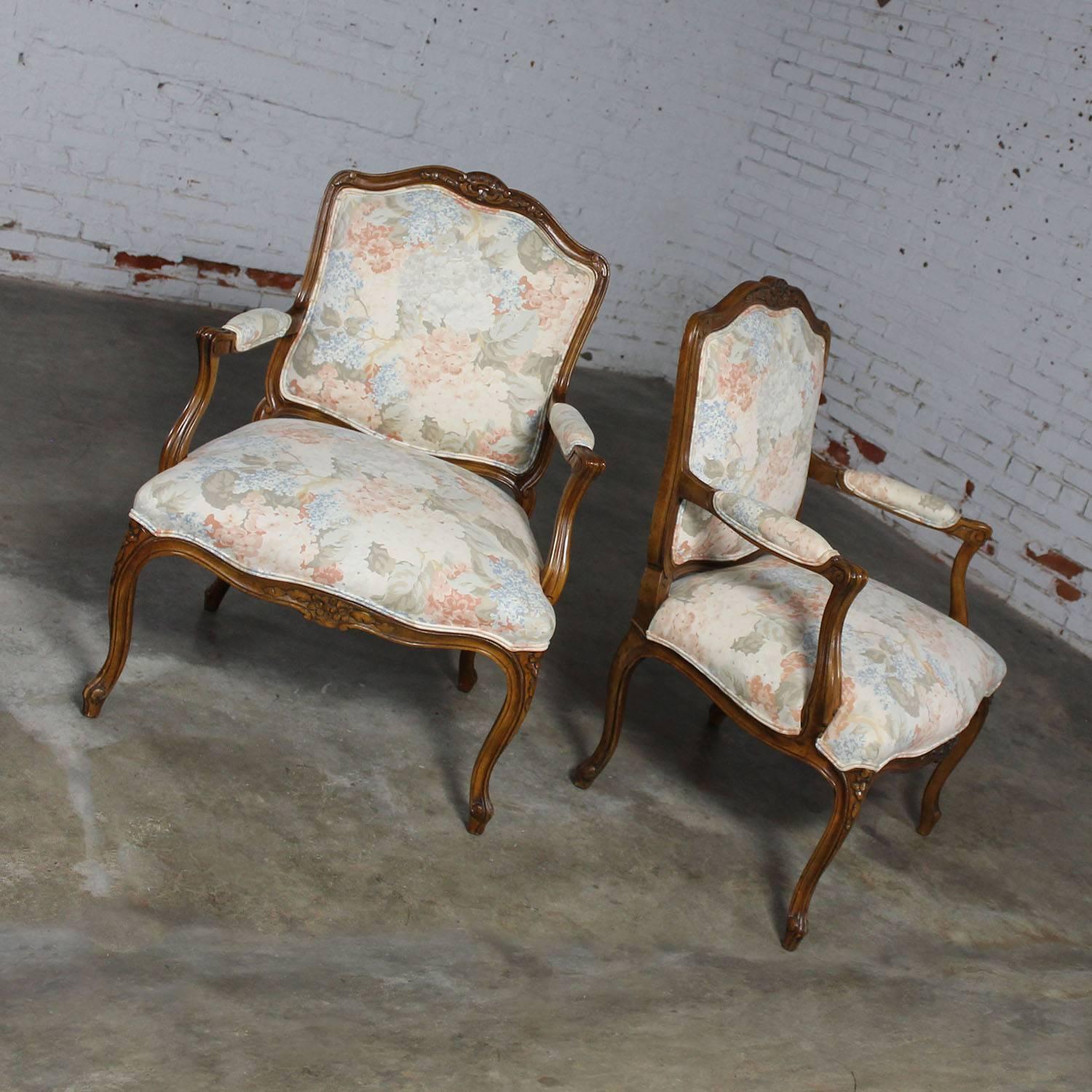 Beautiful pair of Louis XV style fauteuil armchairs. This lovely pair are, circa 1962 by Heritage Furniture and in awesome vintage condition with a gorgeous pastel French Country style upholstery.

This wonderful pair of fauteuil chairs in a Louis