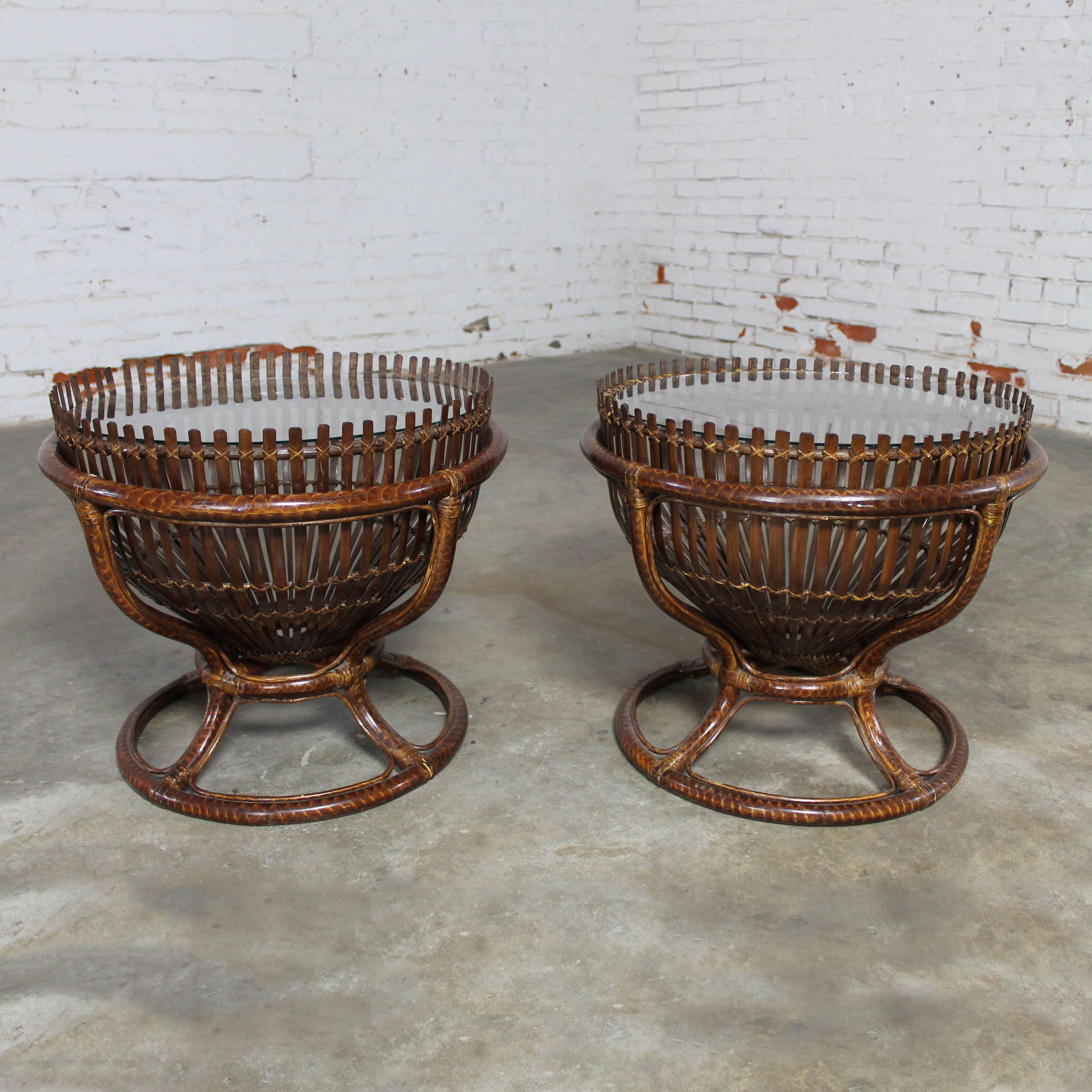 Fabulous pair of fish trap basket tables in rattan stands with glass tops. Made in the style of Franco Albini. This pair is in exceptionally good condition and have new 3/8-inch glass tops, circa 20th century.

Such a handsome pair of side tables!