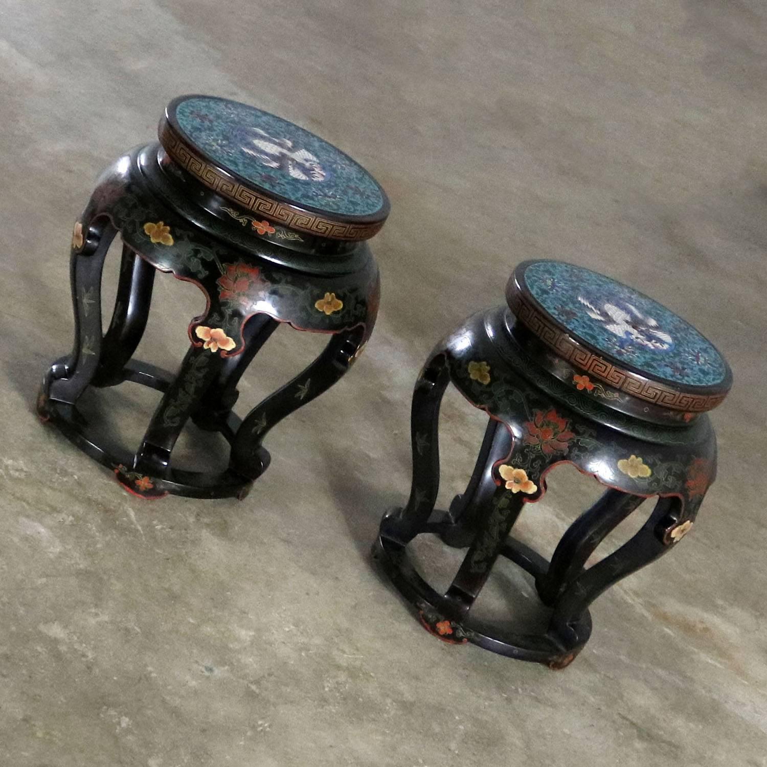 A superb pair of Chinese black lacquered stools or side tables with gorgeous cloisonné tops. They are in fabulous vintage condition. We believe them to be, circa 20th century and most likely 1920-1960.

This set of two Chinese drum style Chinoiserie
