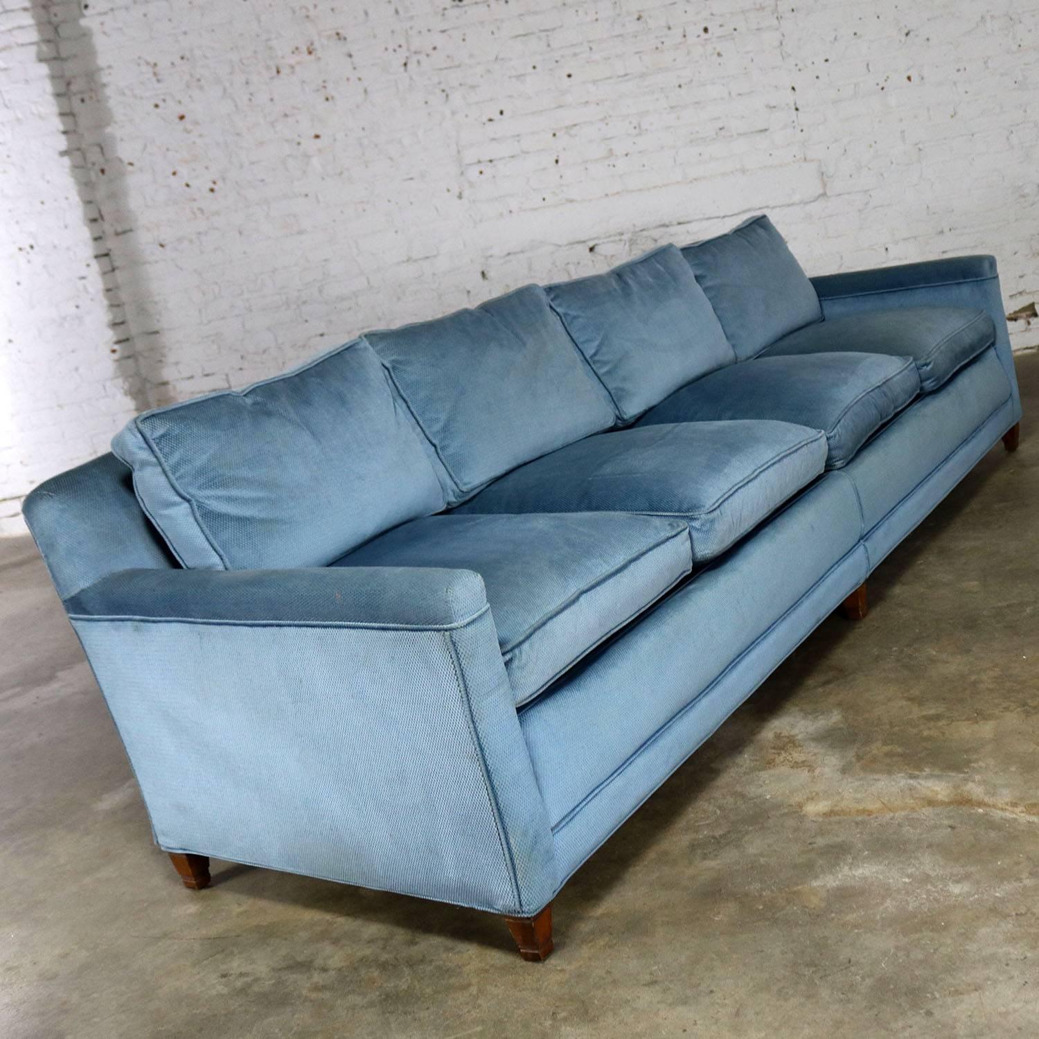 Slender and simple Lawson style four cushion sofa in powder or Wedgwood blue upholstery. This vintage sofa is circa 1960s and in wonderful condition. The seat cushions are foam with feather/down wrap and the back pillows are all feather or down. The