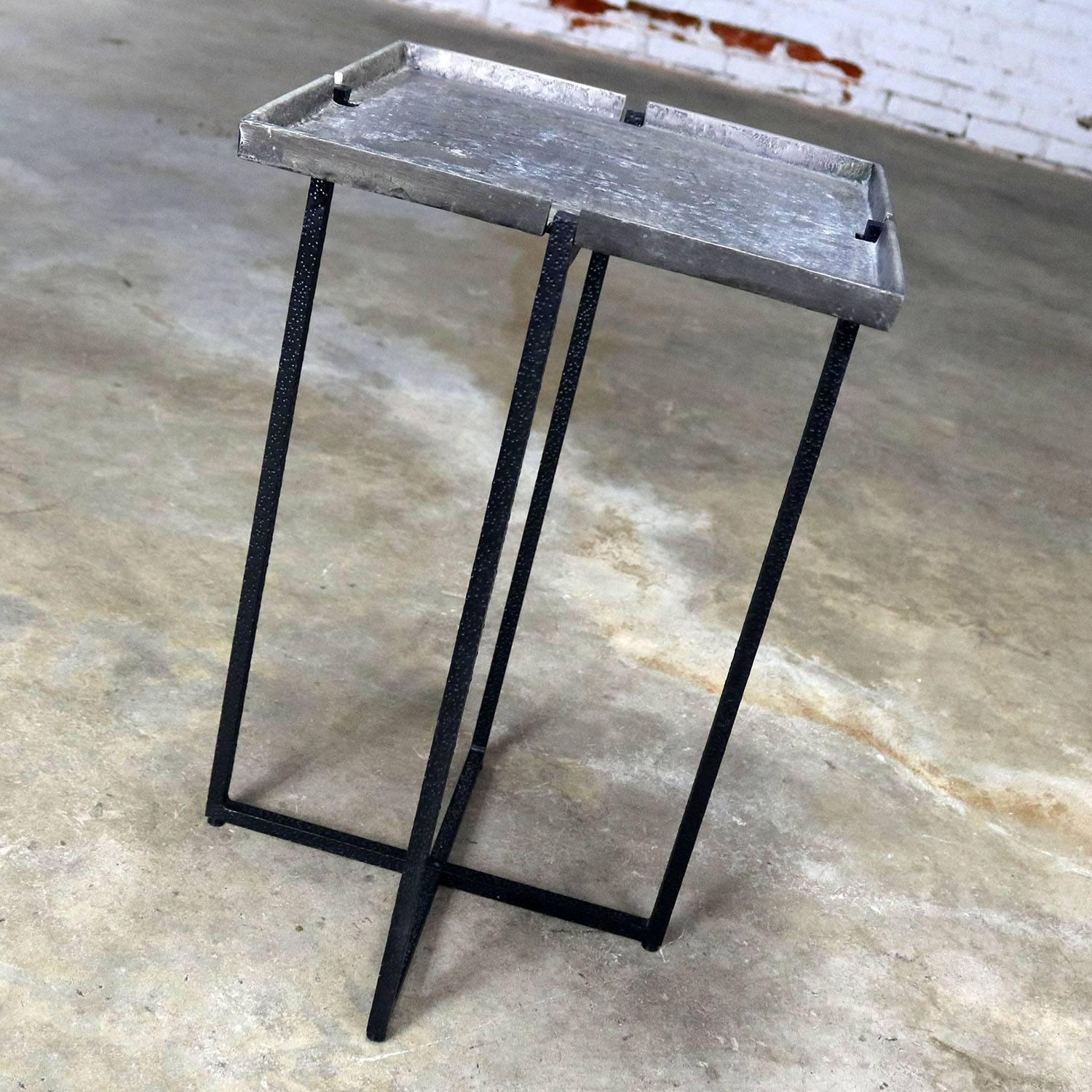 Wonderful small square side table by Michael Aram. Black iron base and removable silvered bronze top. In fabulous condition, circa 21st century.

Petite go anywhere accent table by 21st century contemporary artist Michael Aram. This clever and