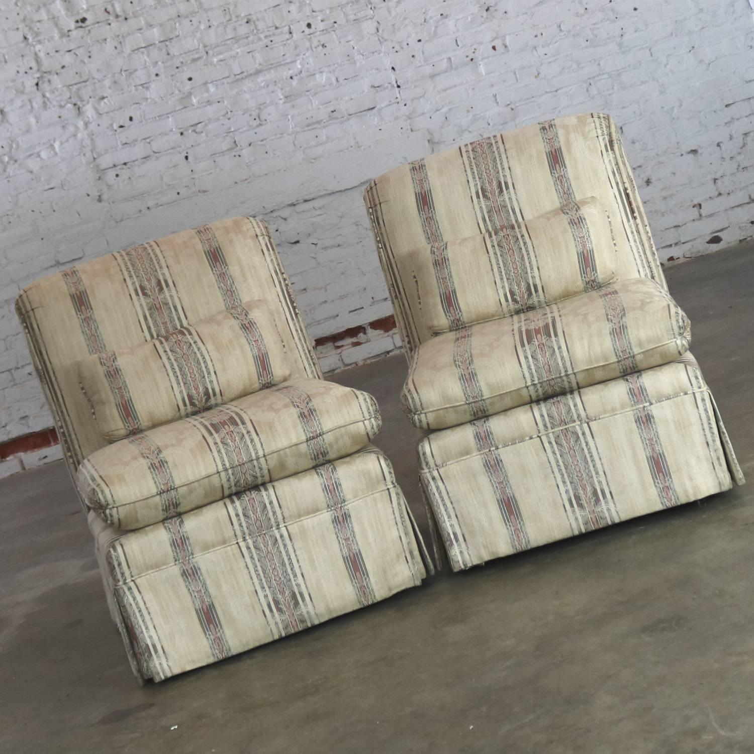 Handsome pair of vintage slipper chairs with roll back and Classic striped fabric. In wonderful condition circa 1980s.

Sometimes you just need a Classic. Enter this pair of roll back slipper chairs. Simple Classic design with flair. This pair of