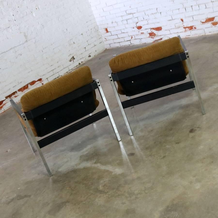 Offering now a pair of chrome, black and brown sling lounge chairs number 683 designed by Jerry Johnson from the Encino Collection for Landes Manufacturing Company. Circa 1970s in good vintage condition.

These are incredible chairs. They are part