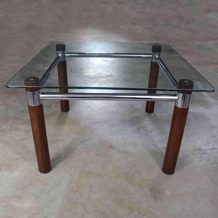 Awesome Mid-Century Modern end table. Comprised of oak and chrome with a glass top in wonderful vintage condition but does have a small chip on the edge of the 3/8-inch glass, circa 1960s-1970s.

Such a handsome end table or smaller coffee table