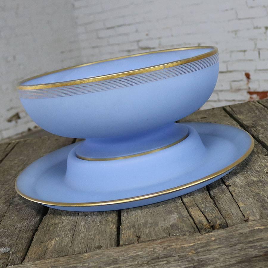 Gorgeous gold rimmed azure blue frosted glass punch bowl with a separate charger platter, circa mid-20th century and in wonderful vintage condition with no chips, cracks, or chiggers that we have seen. There is a slight wear to the gold rim but