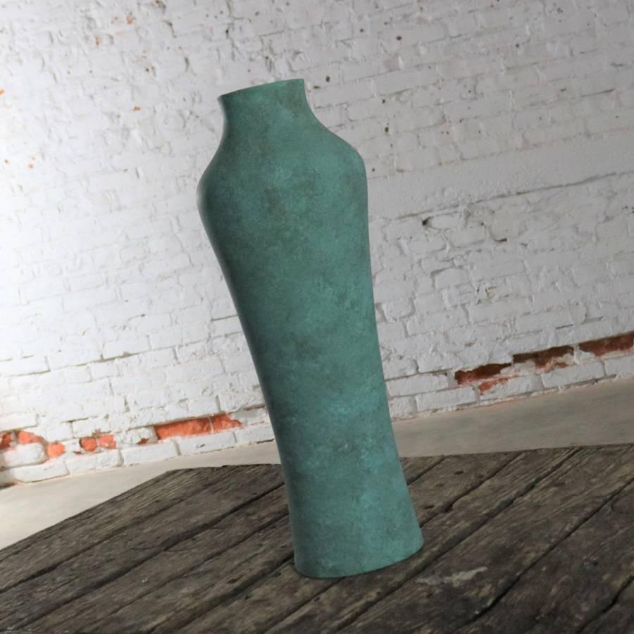 Handsome and monumental in size matte turquoise green vase by Hyalyn Pottery. Gorgeous and in wonderful vintage condition. It does have one small chip on its bottom edge. Please see photos. circa 1960s-1970s.

This wonderful shouldered vase stands
