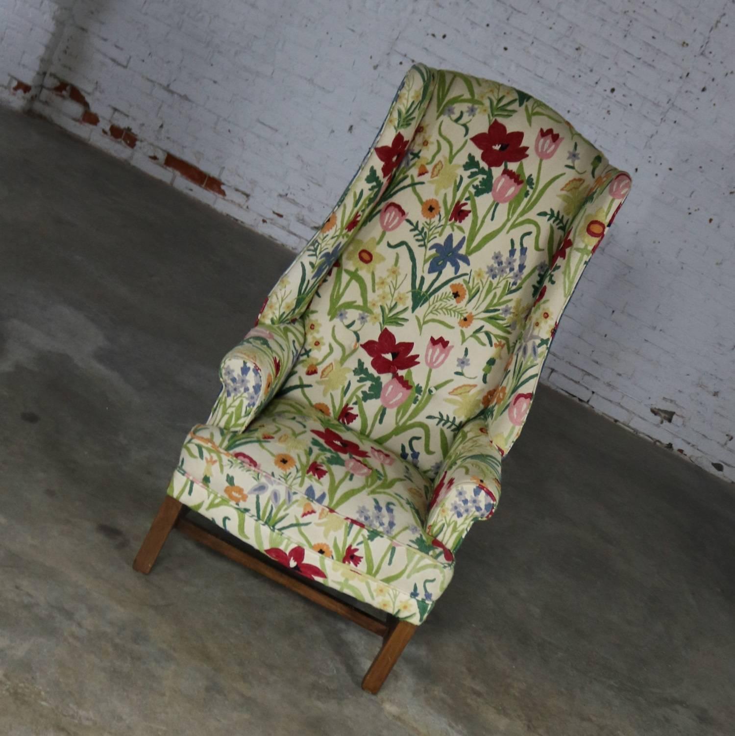 Wonderful bold and bright tall wingback chair with its original crewel floral fabric on front and a great blue nubby fabric on back and sides. It is in fabulous vintage condition, circa 1960s.

I just love the vintage bold and bright crewel floral
