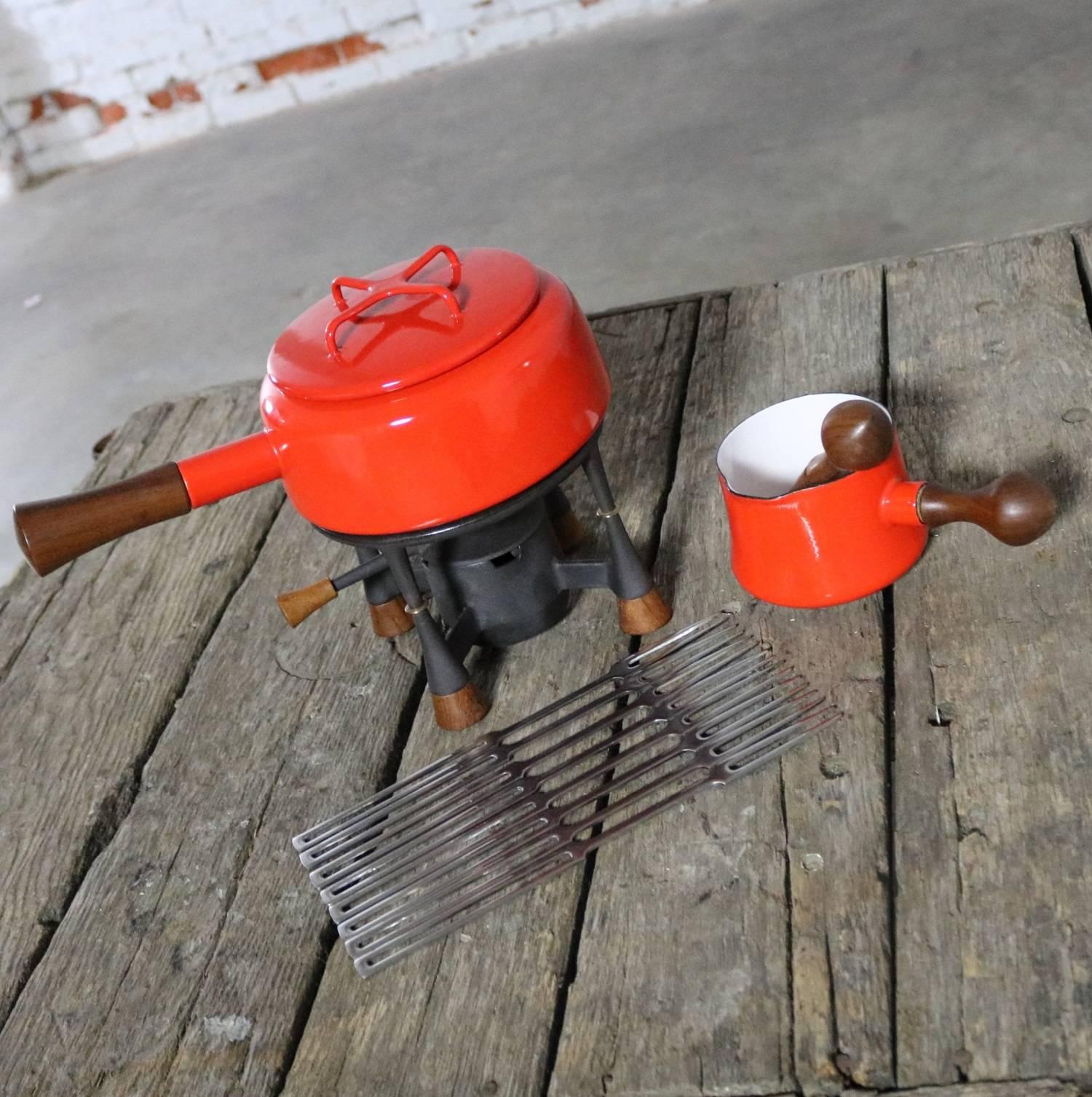 Presenting a set consisting of the Dansk Kobenstyle fondue pot with lid, stand and warmer; along with a Dansk Kobenstyle butter warmer/sauce pan with basting brush; plus, a set of eight Dansk France IHG stainless-steel fondue forks. All are in