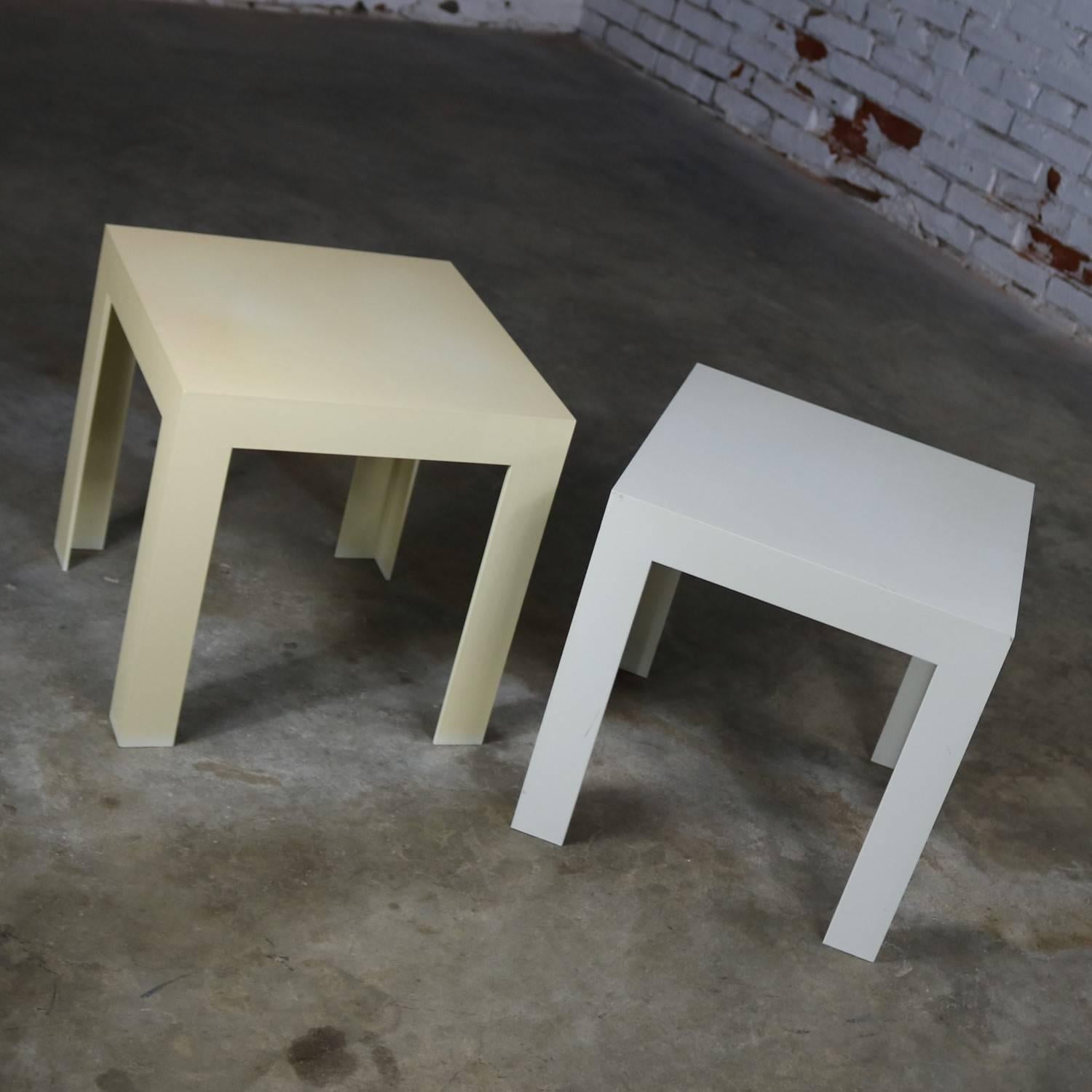 Classic Parsons side tables by Syroco. One of these Mid-Century Modern plastic tables is white and the other is ivory, circa 1960s and they are in wonderful vintage condition. We have priced them as a set but will sell individually. Message us for