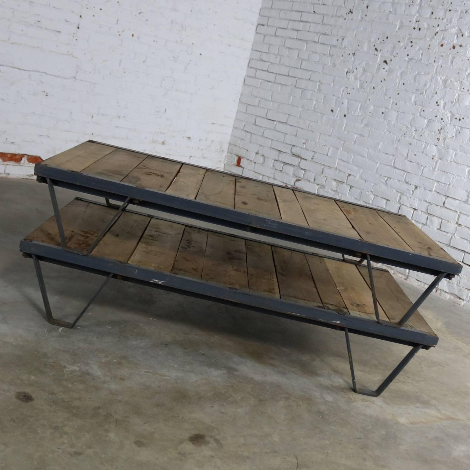 Awesome American Industrial pair of pallets in oak, maybe ash, and steel for use as a fabulous coffee table. They are in very solid sturdy condition with loads of age patina, circa 1930s or prior.

These are quite the pair and make the most
