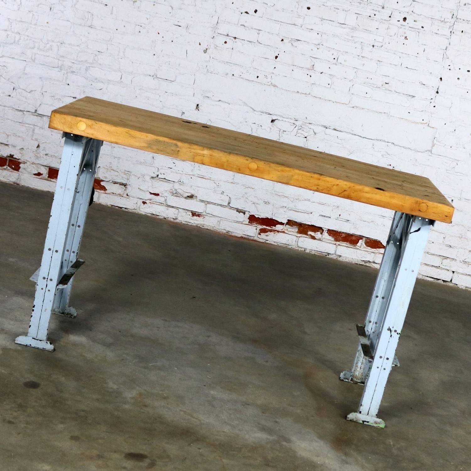 Amazing American Industrial work table with its original wood top and painted steel base. It is in solid sturdy condition and both top and base provide awesome age patina. We have sanded and oiled the wood surface, so it is ready to use but have not