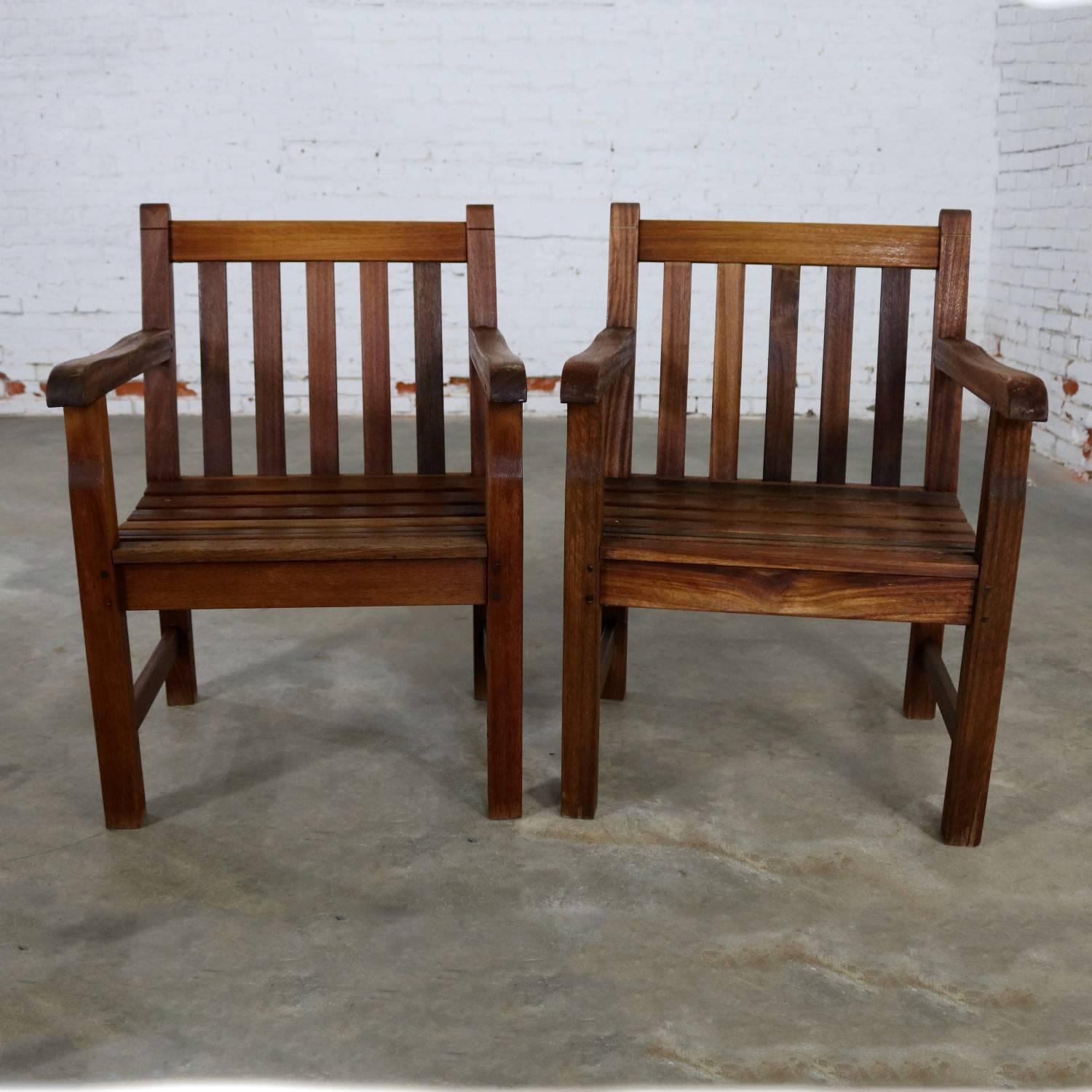 Handsome natural teak vintage Windsor outdoor patio or deck armchair. We have a total of 4 and are pricing them per chair. These chairs are in wonderful sturdy condition with the natural age patina of teak that has spent some time outside but cared